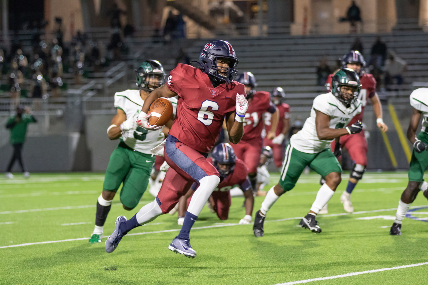 Tompkins running back Marquis Shoulders runs for a touchdown during the Falcons' win over Mayde Creek on Thursday evening at Legacy Stadium.