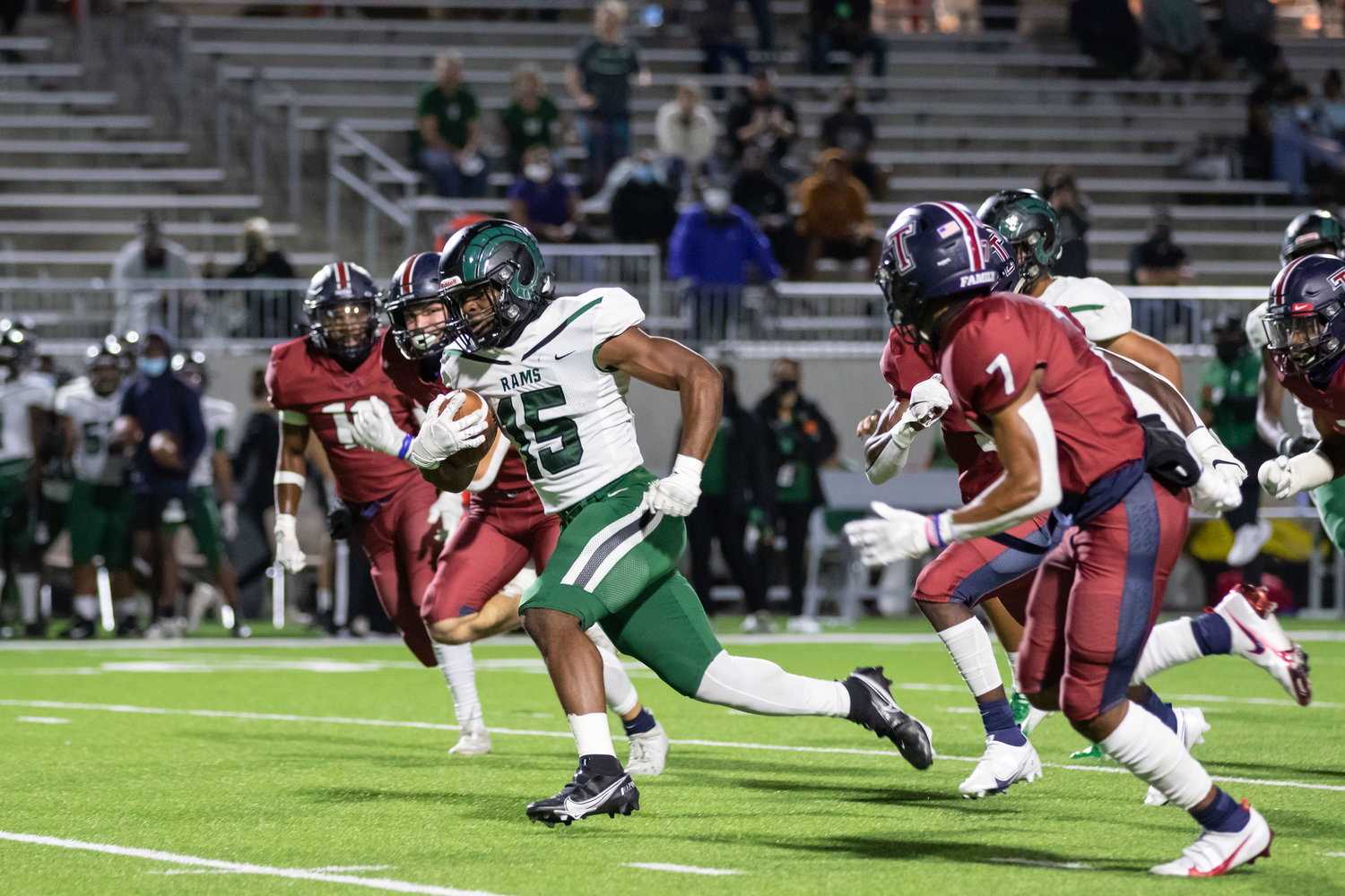 Mayde Creek running back Julius Loughridge gains separation from defenders during Tompkins' win over Mayde Creek on Thursday evening at Legacy Stadium.