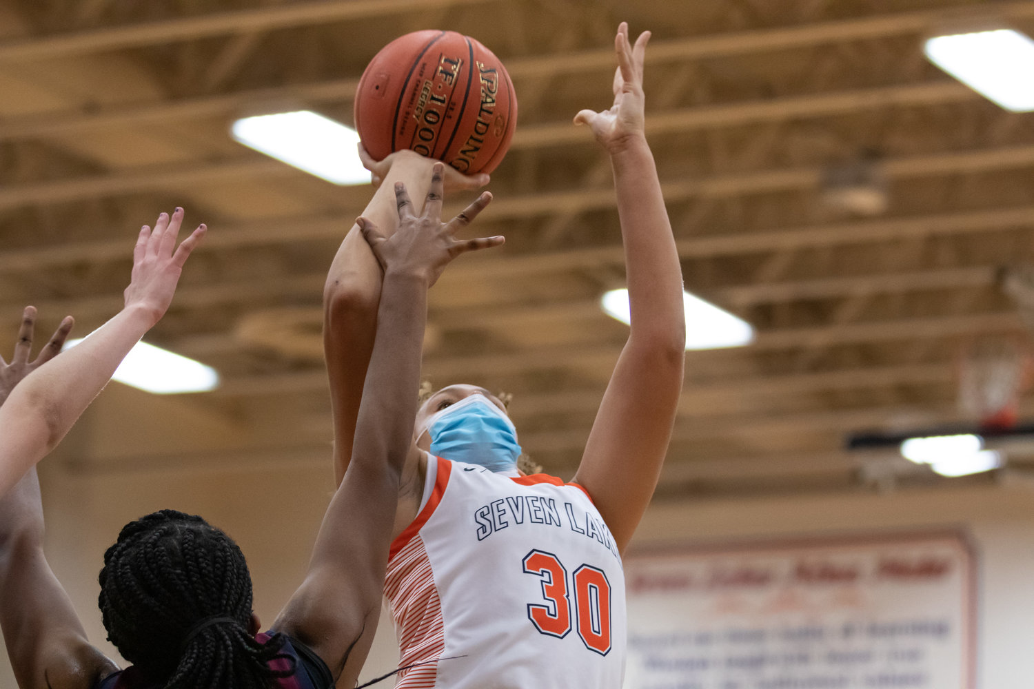 Seven Lakes freshman forward Justice Carlton goes up for a shot during a game against Tompkins on Tuesday, Dec. 29, at Seven Lakes High.