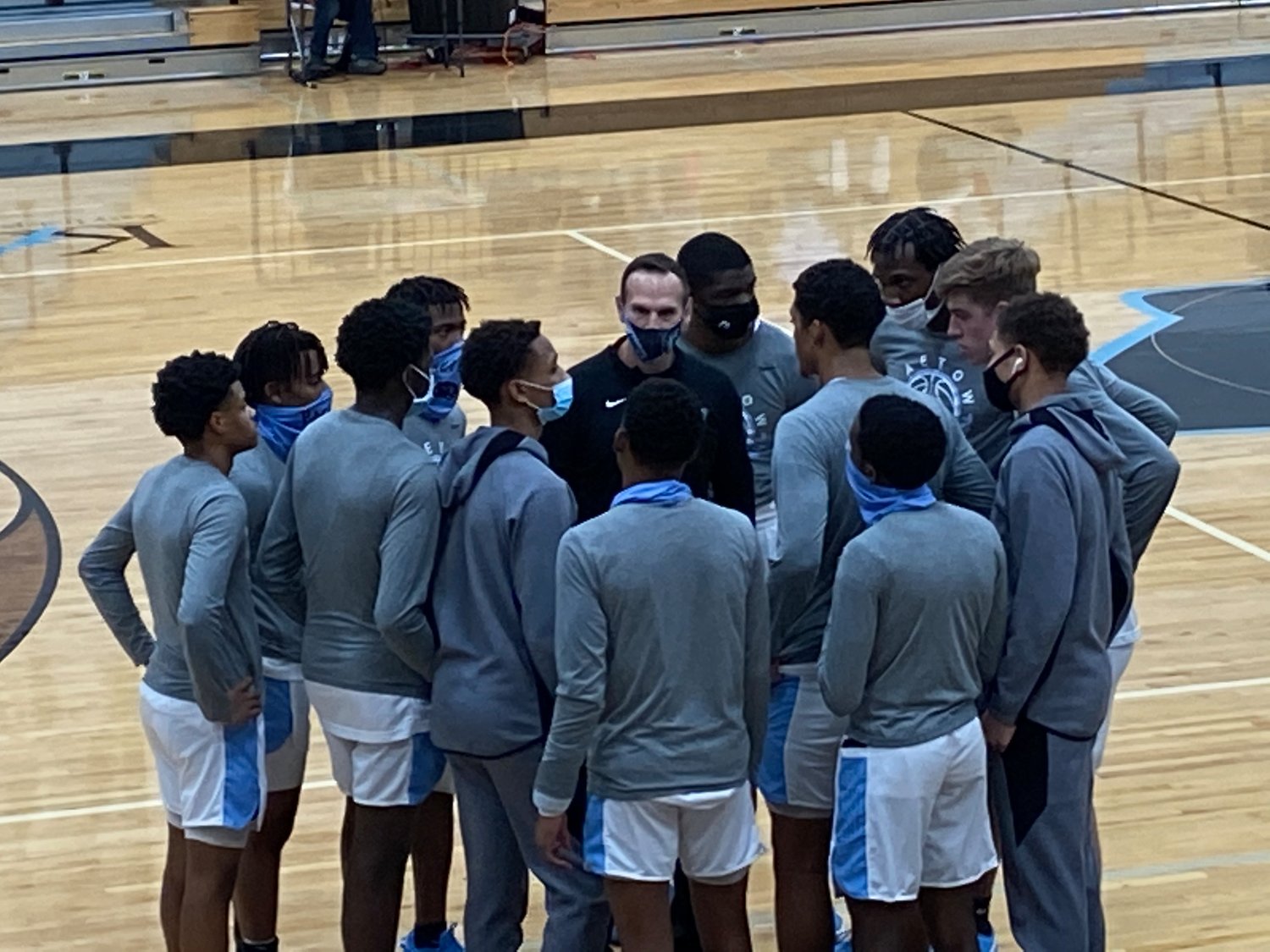 Paetow lead assistant coach Chuck Arnold, middle, talks to the Panthers prior to their district game against A&M Consolidated on Jan. 5 at Paetow High.