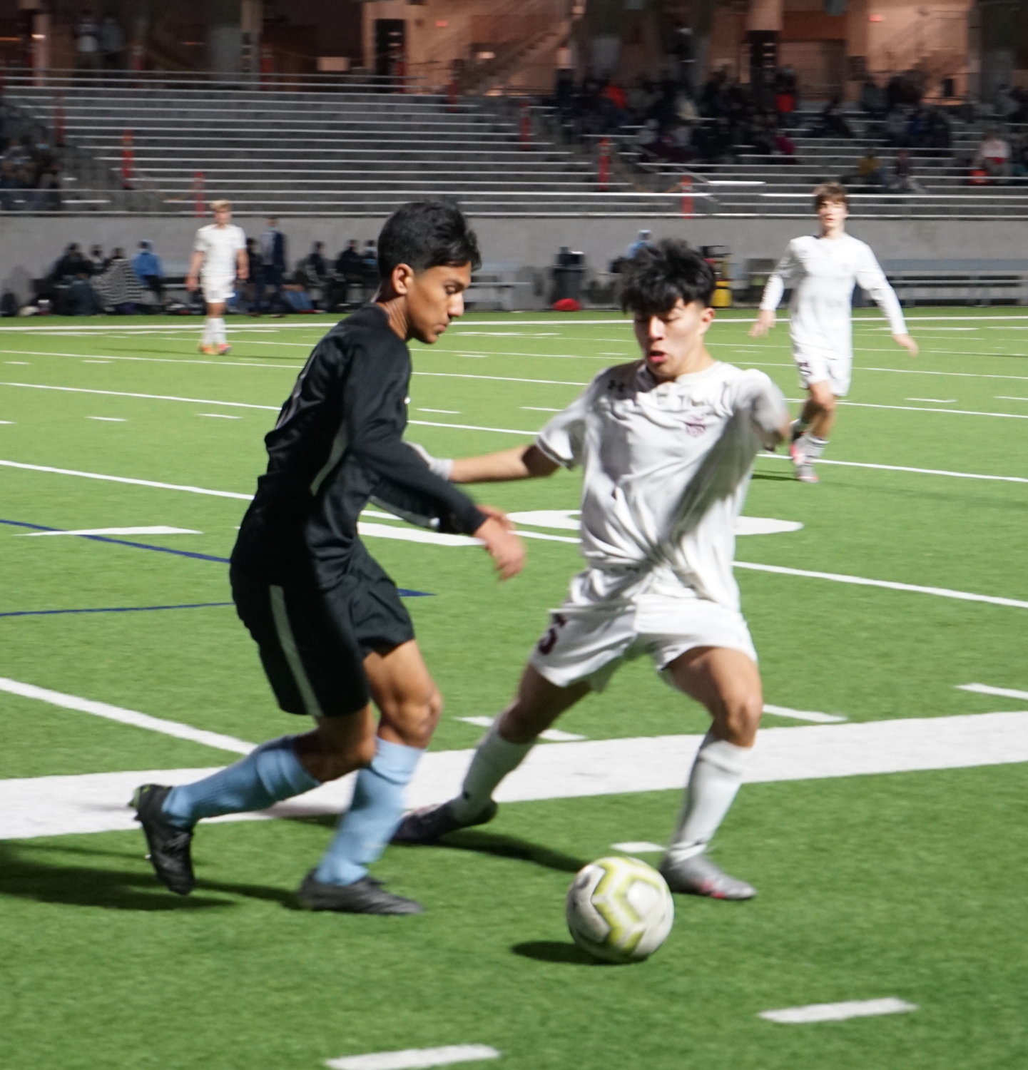 Paetow freshman Erick Tierrafria (left) competes for possession against an A&M Consolidated player during a District 19-5A game Friday, March 19, at Legacy Stadium.