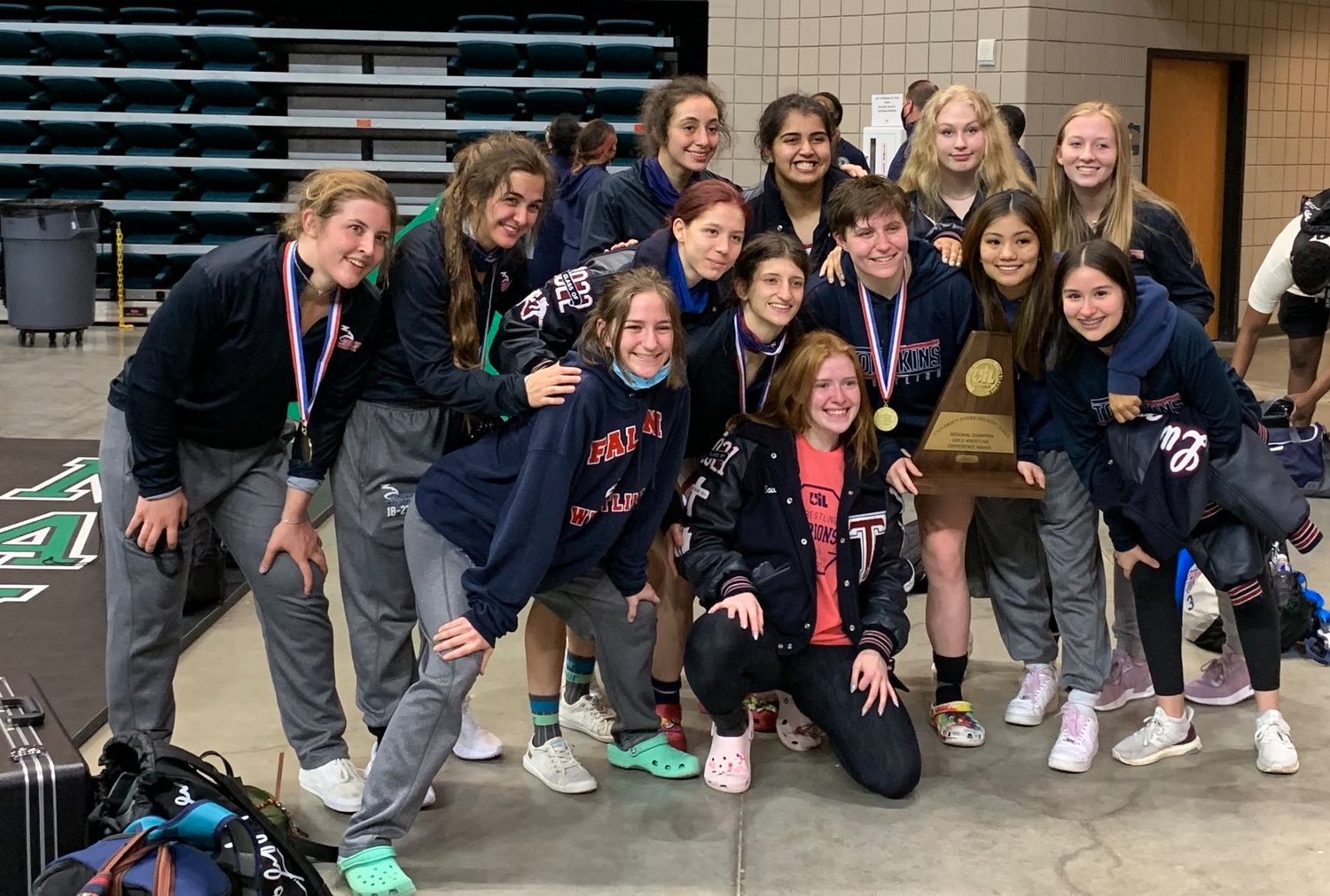 The Tompkins girls won their second straight team regional wrestling title by scoring 145 points at the Class 6A Region III wrestling meet Saturday, April 17, at the Merrell Center. The Falcons had three regional champions. All are undefeated this season.