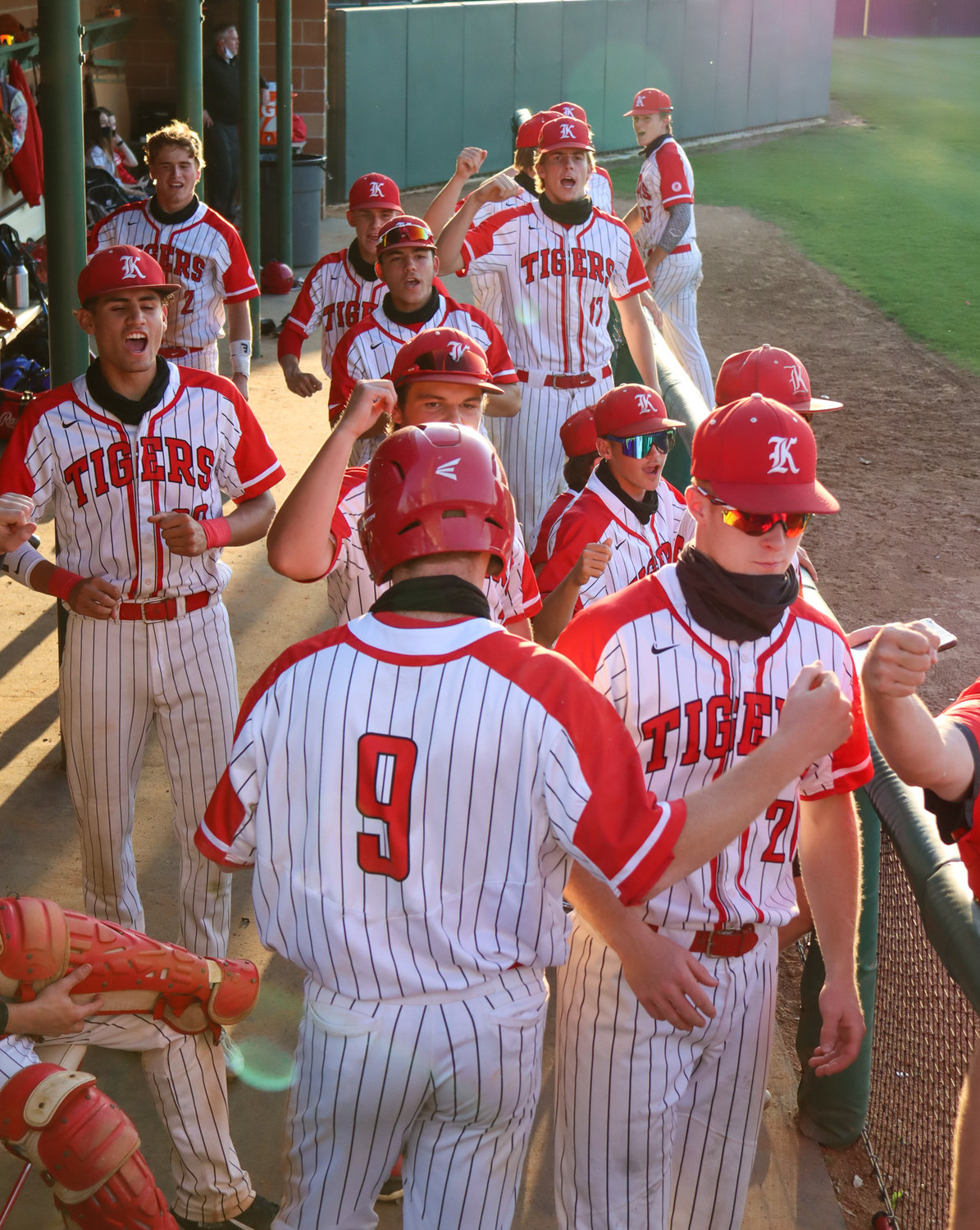 Katy players celebrate in the dugout during their game against Seven Lakes on Tuesday, April 20, at Katy High.