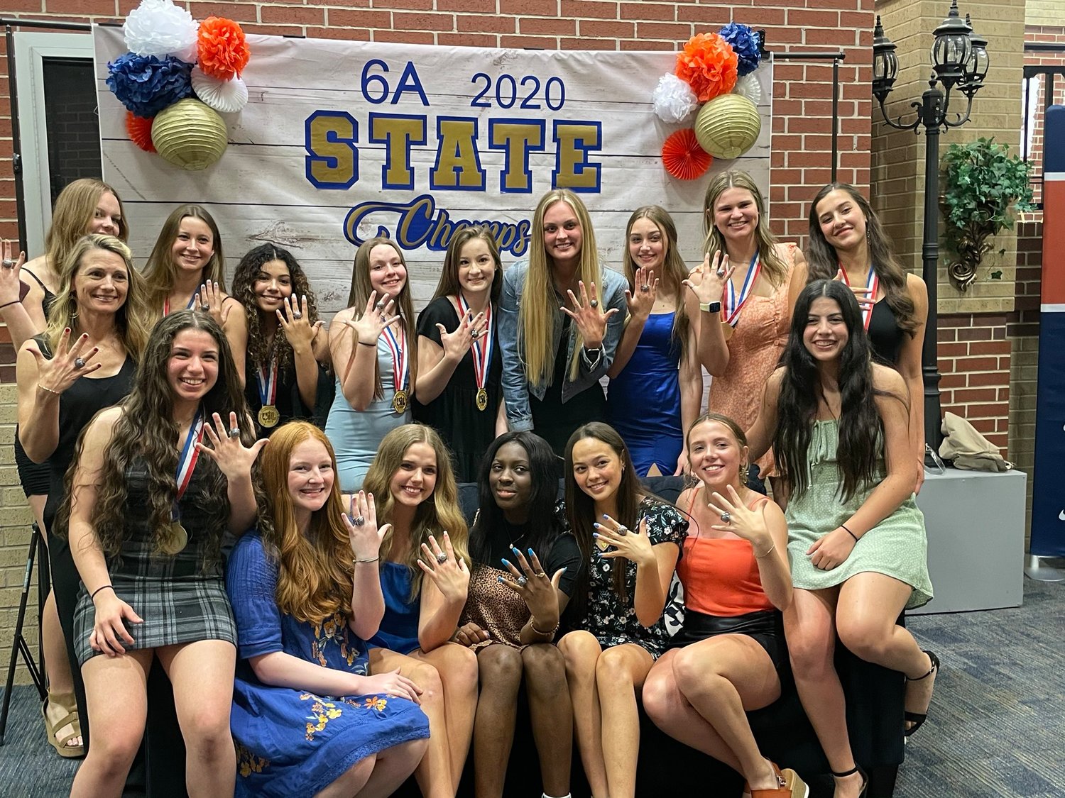 Seven Lakes' volleyball players, including Ally Batenhorst (fourth from left in the back row) show off their state championship rings at an awards ceremony Monday, May 3, at Seven Lakes High School.