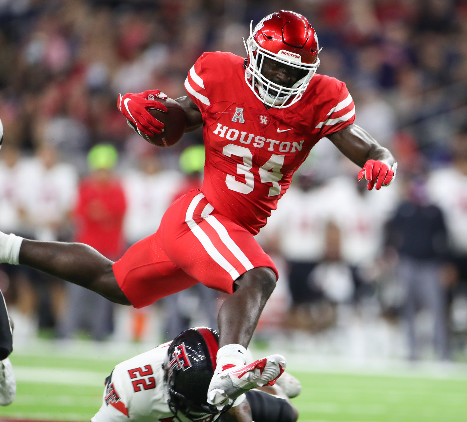 Houston Cougars running back Mulbah Car (34) carries the ball during an NCAA football game between Houston and Texas Tech on September 4, 2021 in Houston, Texas.