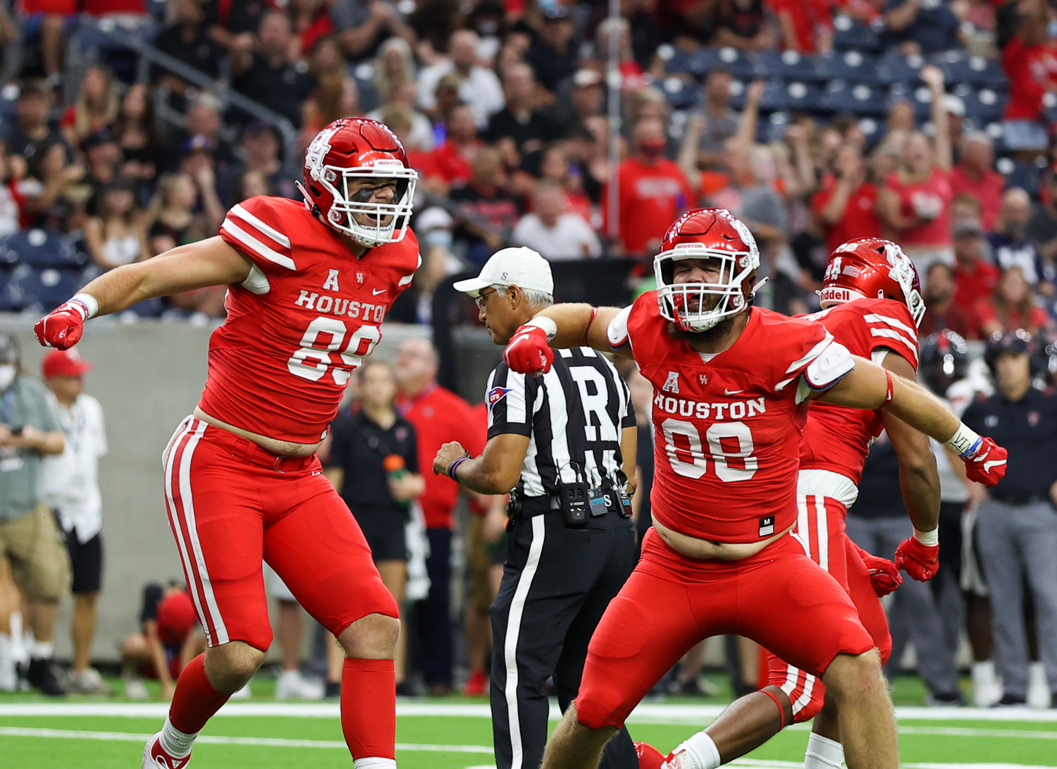 Houston Cougars tight end Parker Eichenberger (89) and tight end Shane Creamer (88) celebrate a play during an NCAA football game between Houston and Texas Tech on September 4, 2021 in Houston, Texas.