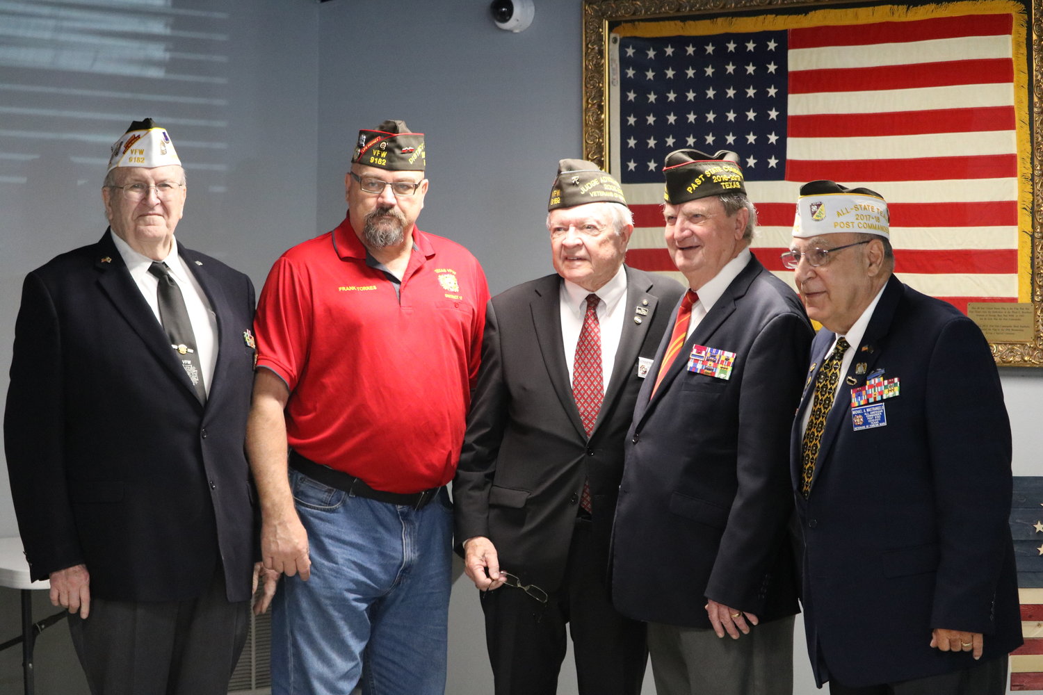 Retired service members pose for a photo after Saturday's 9/11 event at the Katy VFW.