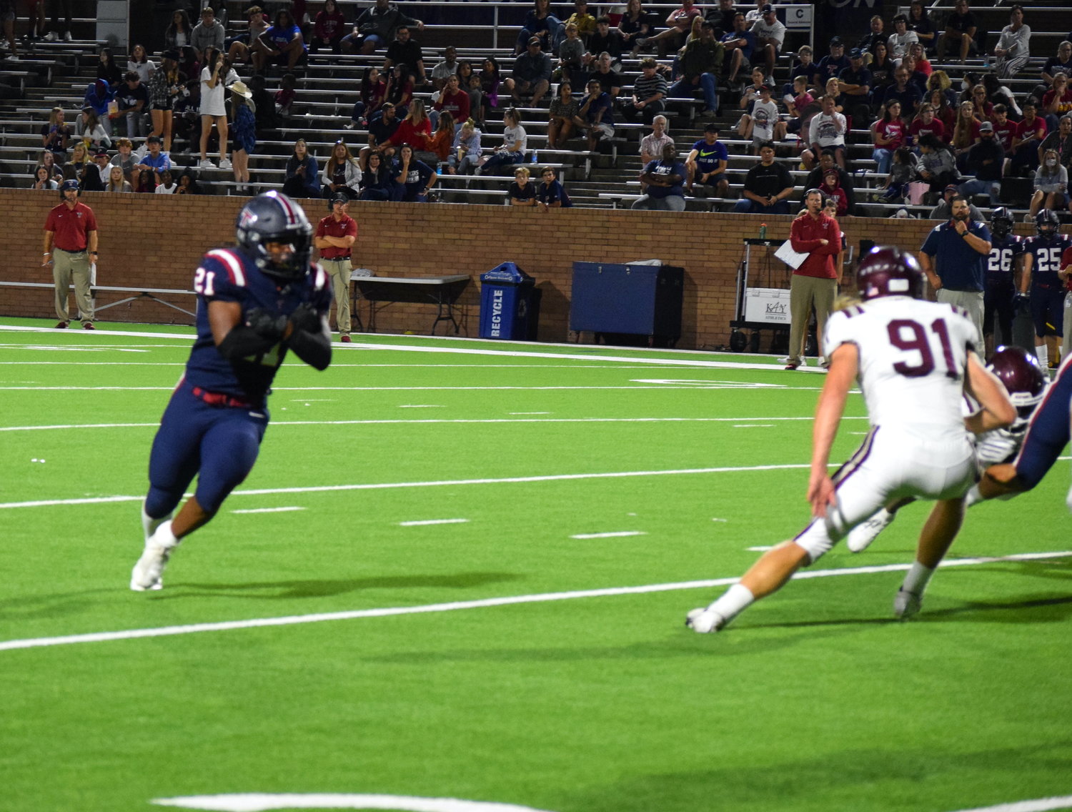 Tompkins’ Caleb Blocker pretends to run with the ball on a play action during a game against Cinco Ranch at Rhodes Stadium on Thursday.