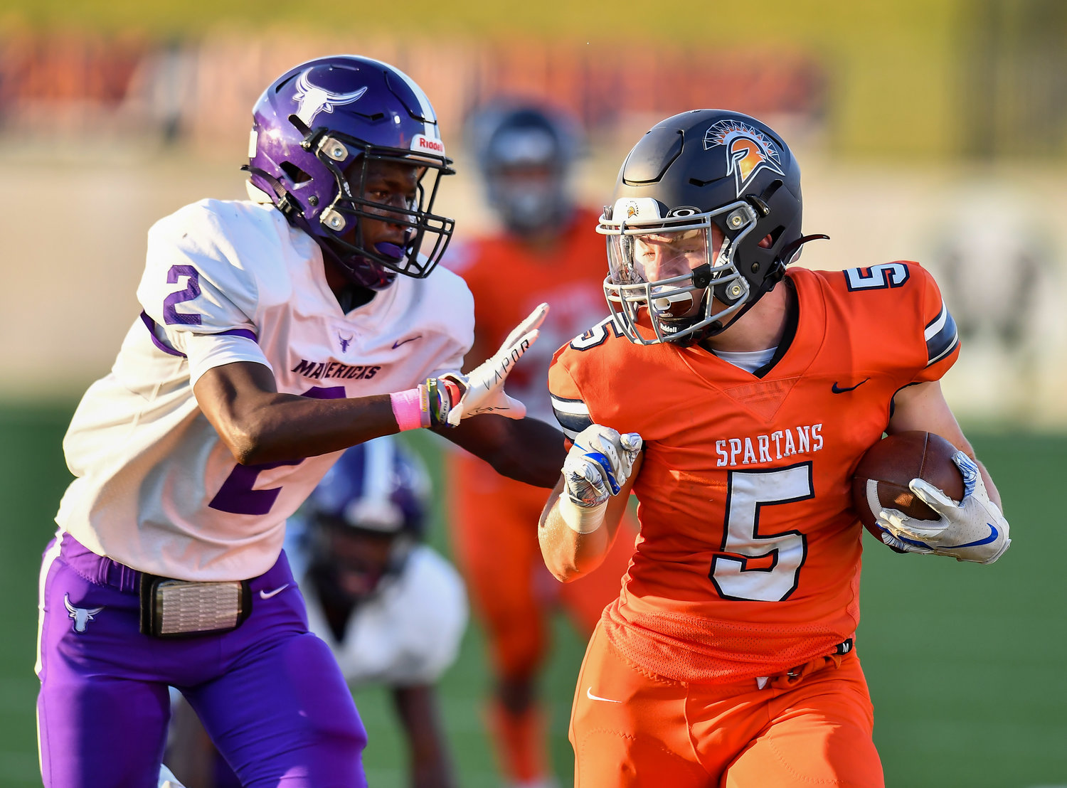Katy, Tx. Oct 8, 2021: Seven Lakes Barrett Hudson #5 picks up the first down before being pushed out of bounds by Morton Ranchs Marcus Jackson #2 during a District 19-6A game between Seven Lakes and Morton Ranch at Legacy Stadium in Katy. (Photo by Mark Goodman / Katy Times)