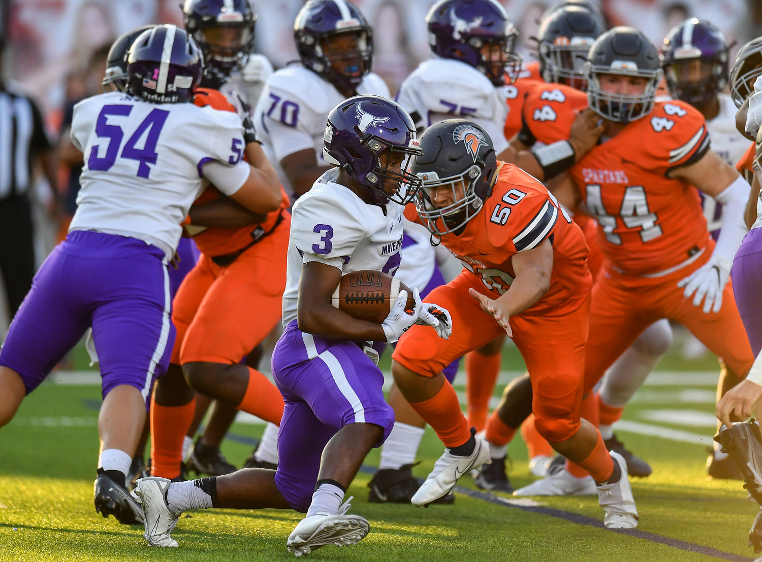 Katy, Tx. Oct 8, 2021: Morton Ranchs Santana Scott #3 carries the ball up the middle during a District 19-6A game between Seven Lakes and Morton Ranch at Legacy Stadium in Katy. In on the stop is Seven Lakes Jonah Thigpen #50. (Photo by Mark Goodman / Katy Times)