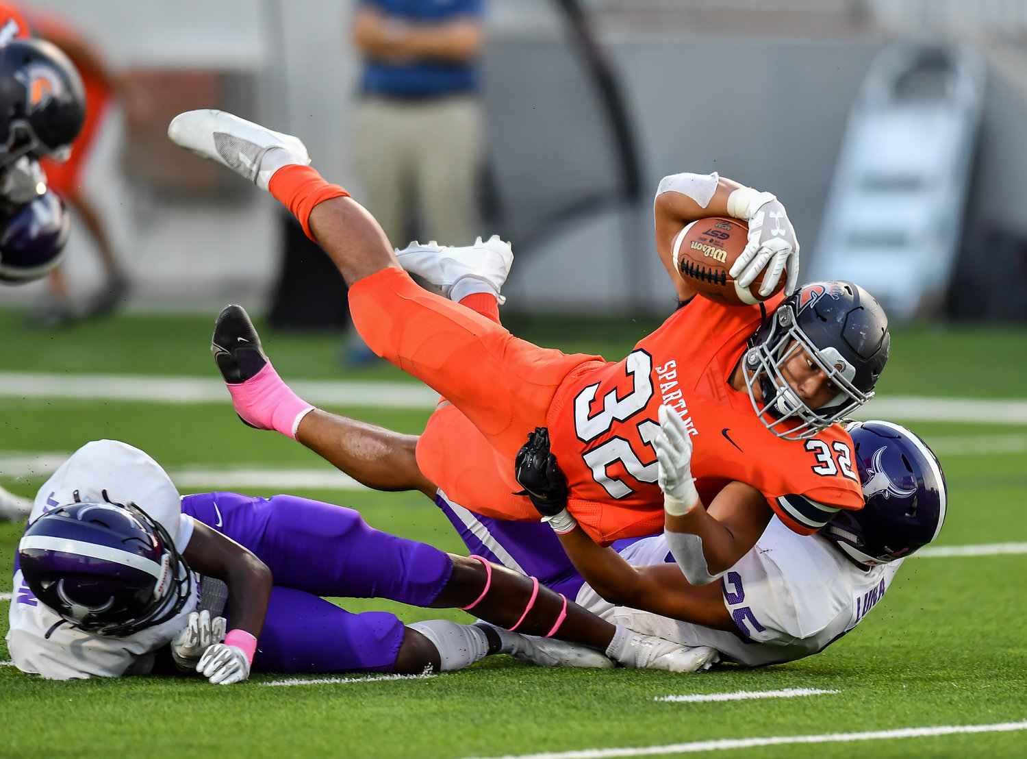 Katy, Tx. Oct. 8, 2021: Seven Lakes Michael Amico #32 dives for the goal line over a couple Morton Ranch defenders scoring a TD during the first half of a District 19-6A game between Seven Lakes and Morton Ranch at Legacy Stadium in Katy. (Photo by Mark Goodman / Katy Times)