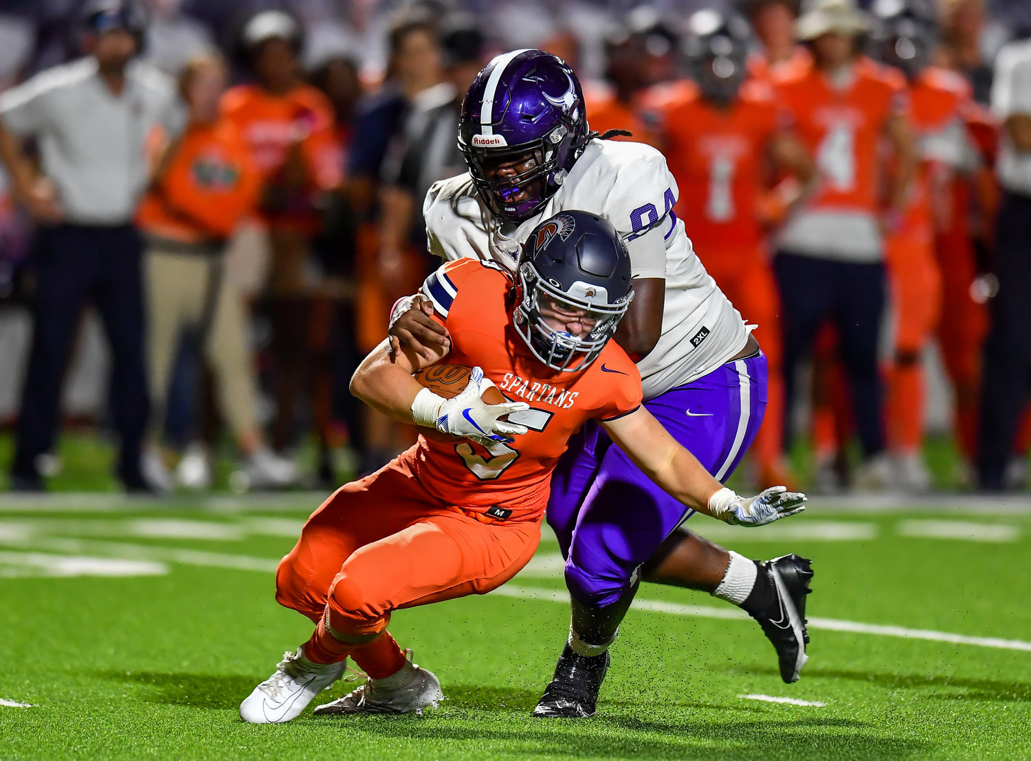 Katy, Tx. Oct. 8, 2021: Morton Ranchs Jamall Lindsey #94  makes the stop in the back field on Seven Lakes Barrett Hudson #5 during a District 19-6A game between Seven Lakes and Morton Ranch at Legacy Stadium in Katy. (Photo by Mark Goodman / Katy Times)