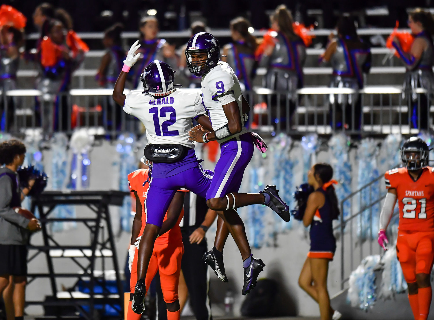 Katy, Tx. Oct. 8, 2021: Morton Ranchs Mike Gerald #12 celebrate a TD with QB Joshua Johnson #9 during a District 19-6A game between Seven Lakes and Morton Ranch at Legacy Stadium in Katy. (Photo by Mark Goodman / Katy Times)