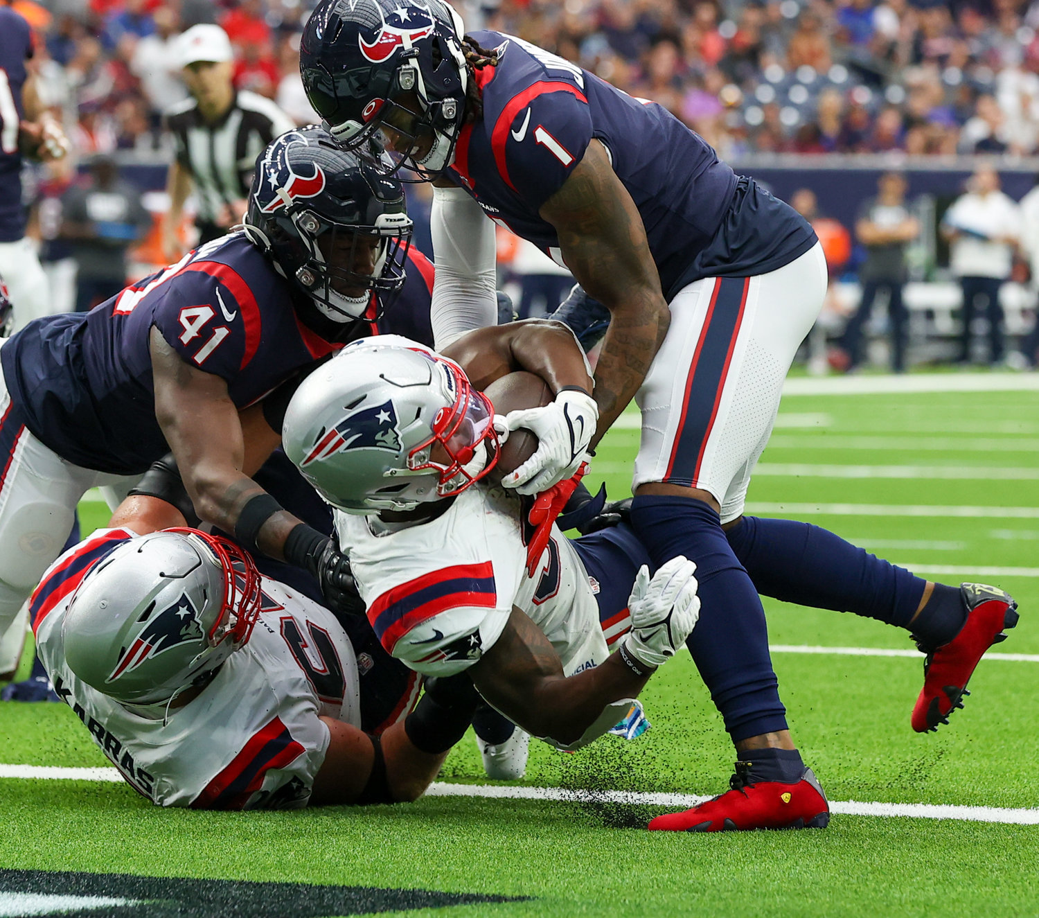 New England Patriots running back Damien Harris (37) scores on a 1-yard touchdown carry during an NFL game between Houston and New England on October 10, 2021 in Houston, Texas. The Patriots won 25-22.