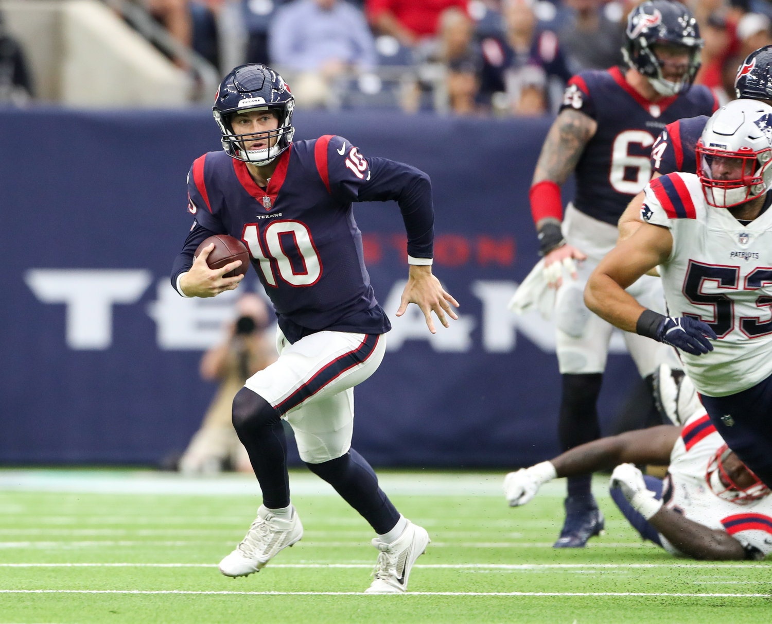 Houston Texans quarterback Davis Mills (10) scrambles out of the backfield during an NFL game between Houston and New England on October 10, 2021 in Houston, Texas. The Patriots won 25-22.