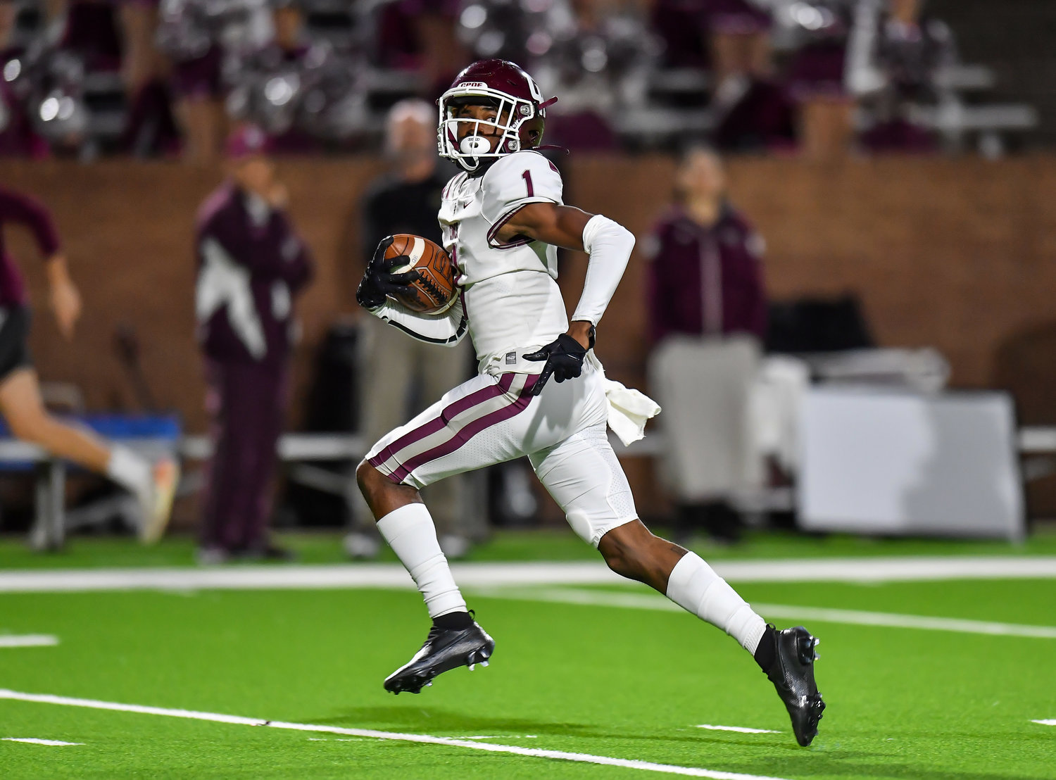Katy, Tx. Oct. 29, 2021: Cinco Ranch's Grayson Williams #1 carries the ball scoring a TD during the first quarter of a conference game between Cinco Ranch and Morton Ranch at Rhodes Stadium in Katy. (Photo by Mark Goodman / Katy Times)