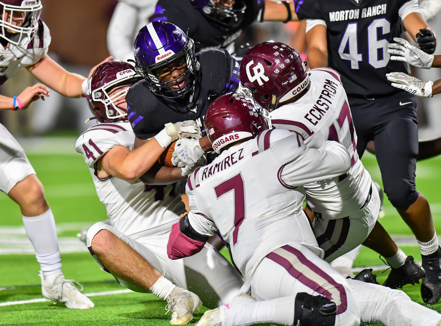Katy, Tx. Oct. 29, 2021: Cougar defense makes the stop on Morton Ranch's Santana Scott #3 during a conference game between Cinco Ranch and Morton Ranch at Rhodes Stadium in Katy. (Photo by Mark Goodman / Katy Times)