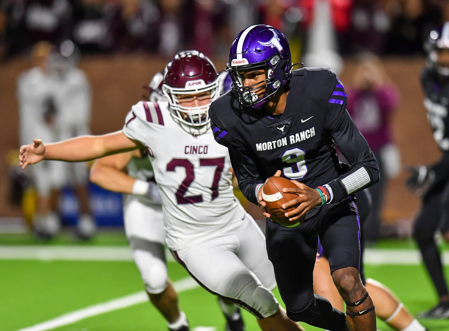 Katy, Tx. Oct 29, 2021: Morton Ranch's QB Joshua Johnson #9 rushes to the outside during a conference game between Cinco Ranch and Morton Ranch at Rhodes Stadium in Katy. (Photo by Mark Goodman / Katy Times)
