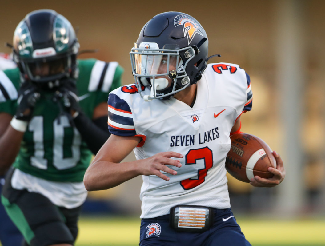Seven Lakes Spartans quarterback Grayson Medford (3) carries the ball during a high school football game between Mayde Creek and Seven Lakes on October 29, 2021 in Katy, Texas. Seven Lakes won, 50-10.