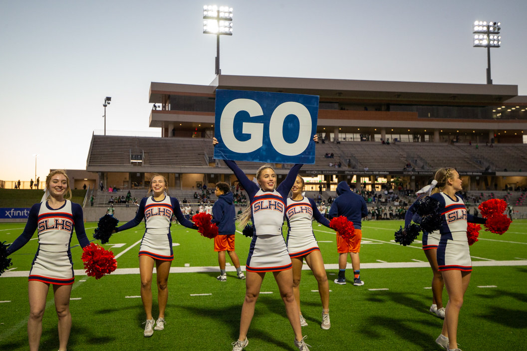 The Seven Lakes Spartans cheerleaders perform during a high school football game between Mayde Creek and Seven Lakes on October 29, 2021 in Katy, Texas. Seven Lakes won, 50-10.