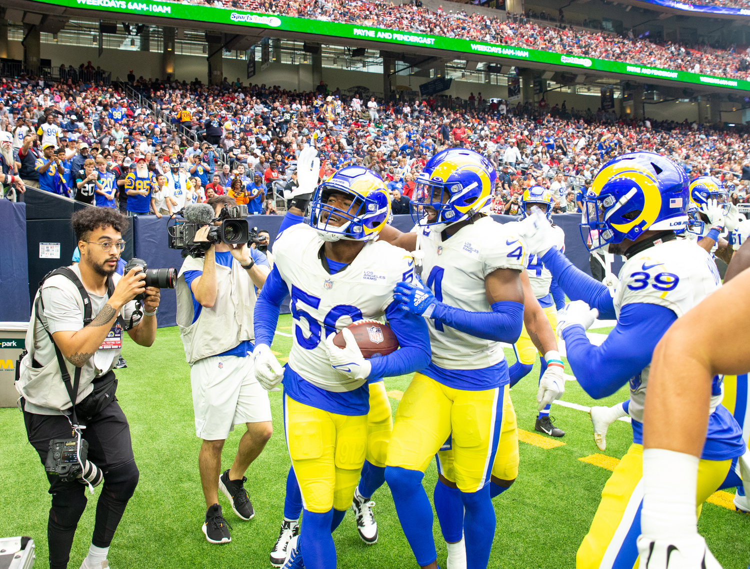 Los Angeles Rams teammates congratulate linebacker Ernest Jones (50) after an interception during an NFL game between Houston and the Los Angeles Rams on October 31, 2021 in Houston, Texas.