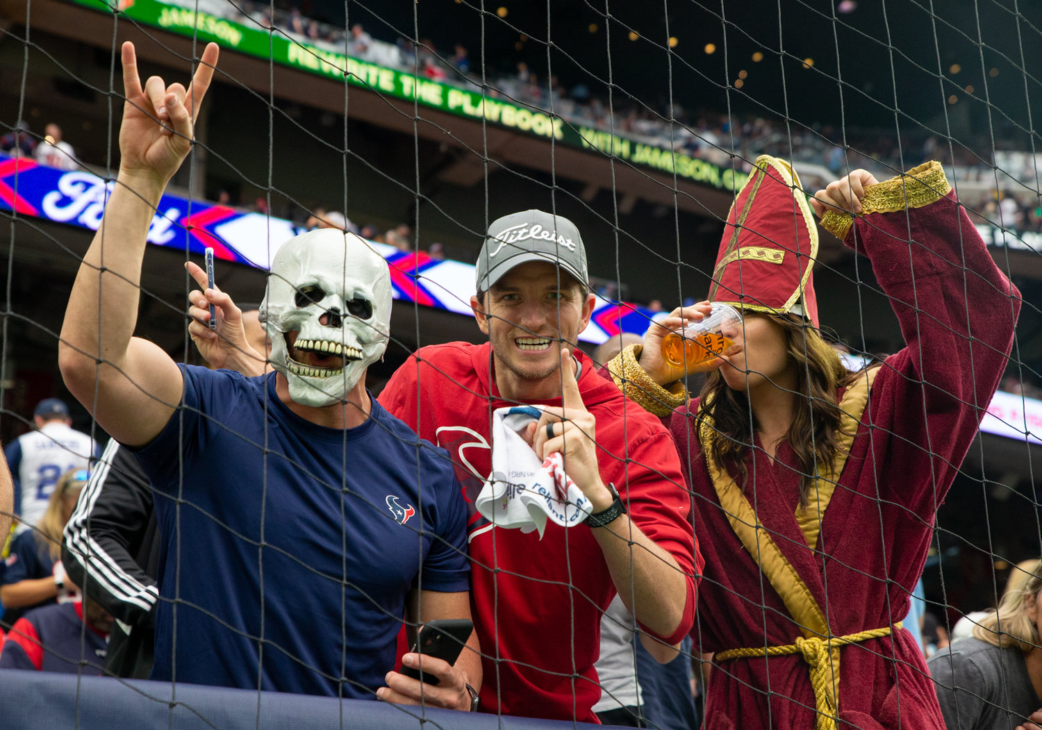 Houston Texans fans wear costumes during Halloween day NFL game between Houston and the Los Angeles Rams on October 31, 2021 in Houston, Texas.