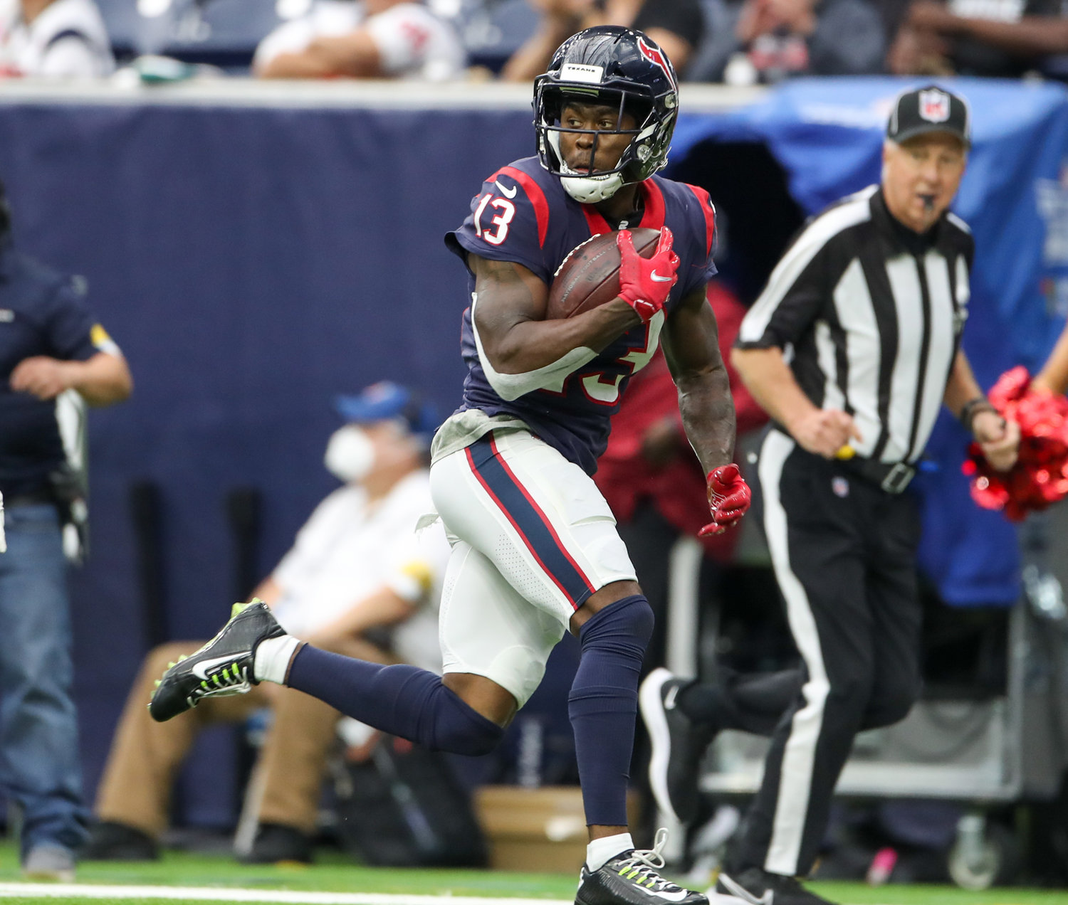 Houston Texans wide receiver Brandin Cooks (13) carries the ball on a 45-yard touchdown reception during an NFL game between Houston and the Los Angeles Rams on October 31, 2021 in Houston, Texas.