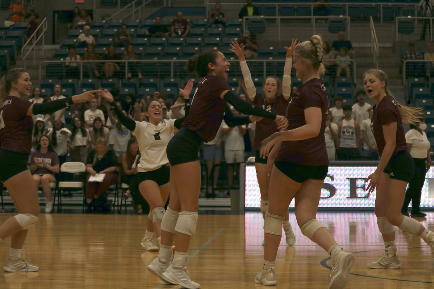 Cinco Ranch players celebrate after winning a point during Tuesday’s bi-district round match against George Ranch at the Merrell Center.