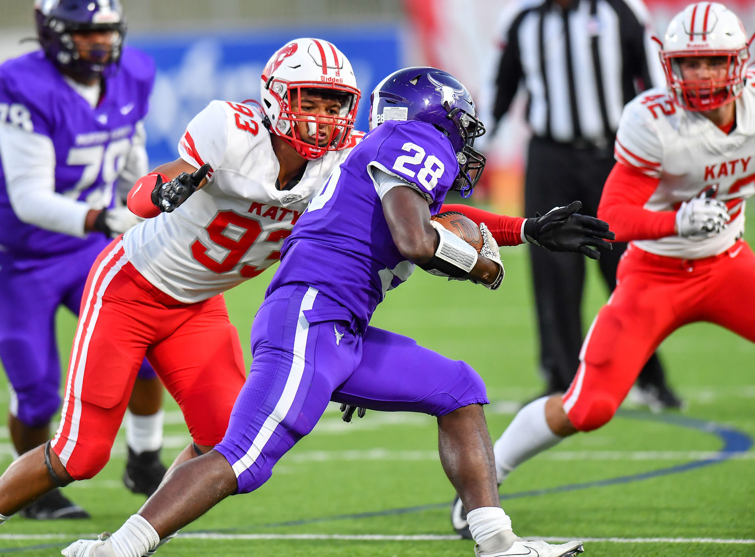 Katy, Tx. Nov 5, 2021: Katy's Broderick Johnson #93 makes the stop on Morton Ranch Ryan's Hall #28 during a conference game between Katy and Morton Ranch at Legacy Stadium in Katy. (Photo by Mark Goodman / Katy Times)