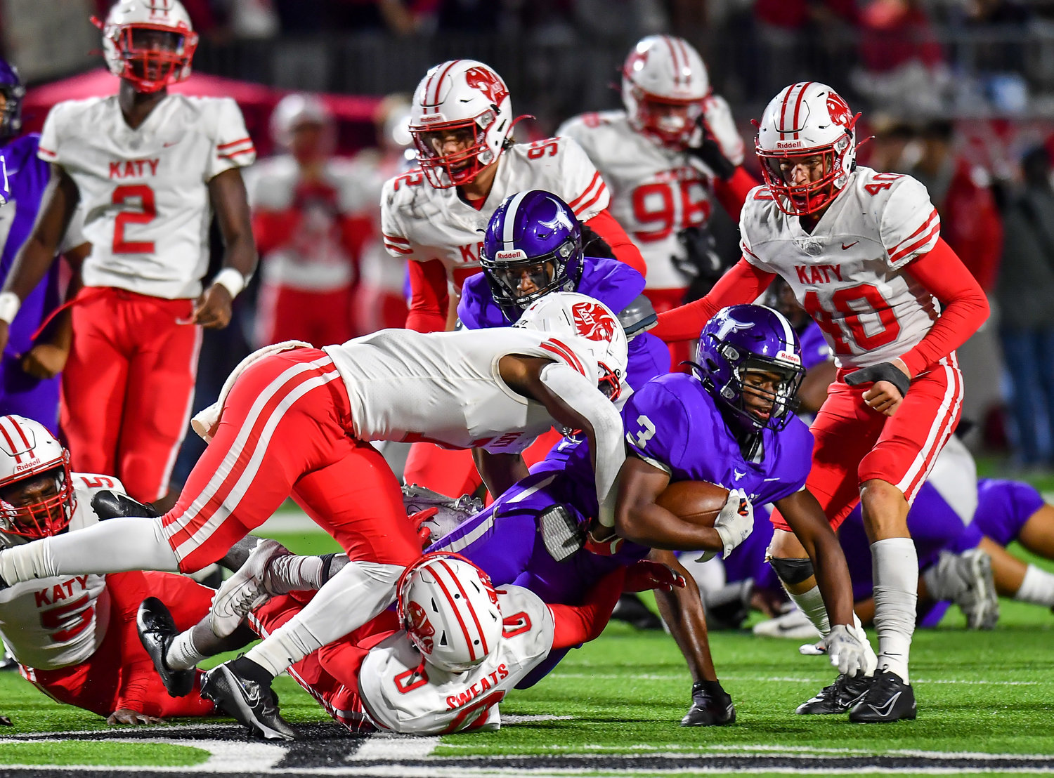 Katy, Tx. Nov 5, 2021: Morton Ranch Santana Scott #3 carries the ball before being brought down by Katy defenders during a conference game between Katy and Morton Ranch at Legacy Stadium in Katy. (Photo by Mark Goodman / Katy Times)