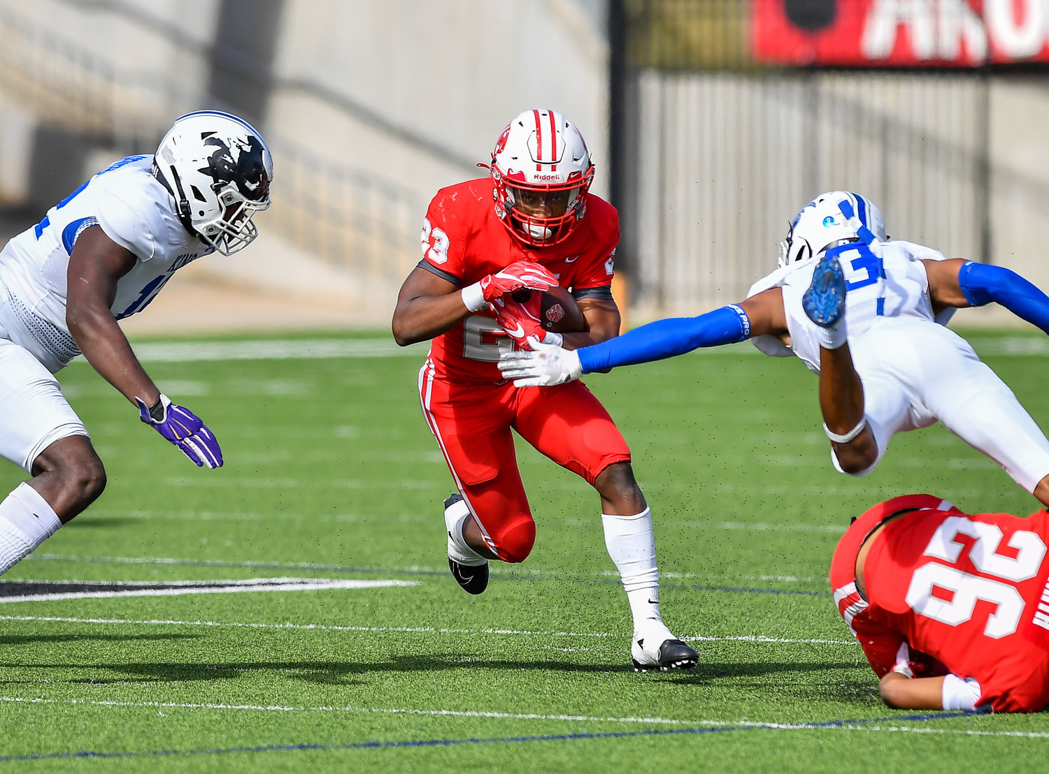 Katy Tx. Nov 26, 2021: Katy's #23 Seth Davis carries the ball picking up the first down during the UIL regional playoff game between Katy Tigers and King Panthers at Legacy Stadium in Katy. (Photo by Mark Goodman / Katy Times)
