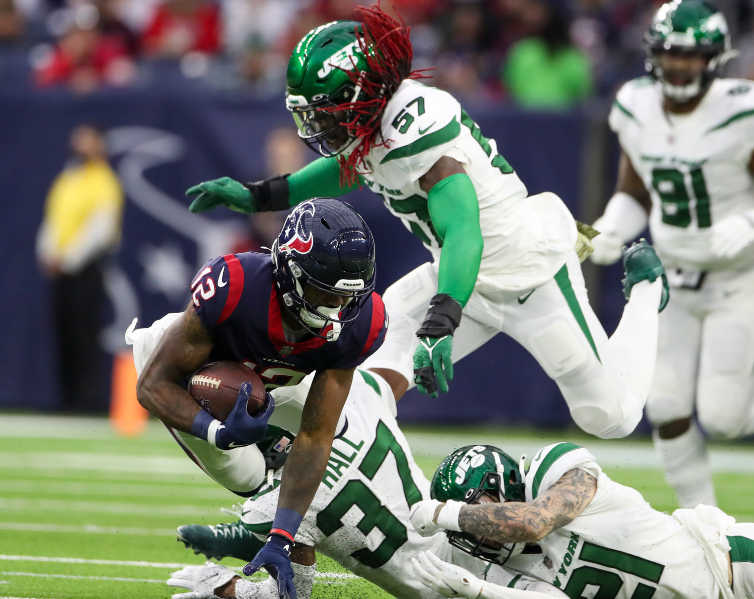 Houston Texans wide receiver Nico Collins (12) is tackled during an NFL game between the Houston Texans and the New York Jets on November 28, 2021 in Houston, Texas. The Jets won, 21-14