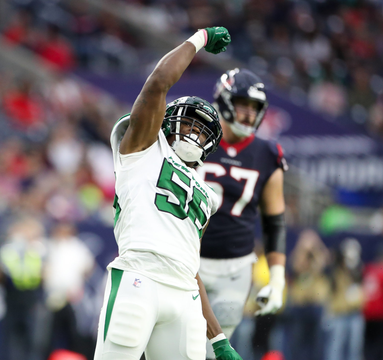 New York Jets linebacker Quincy Williams (56) gestures after making a tackle for loss during an NFL game between the Houston Texans and the New York Jets on November 28, 2021 in Houston, Texas. The Jets won, 21-14