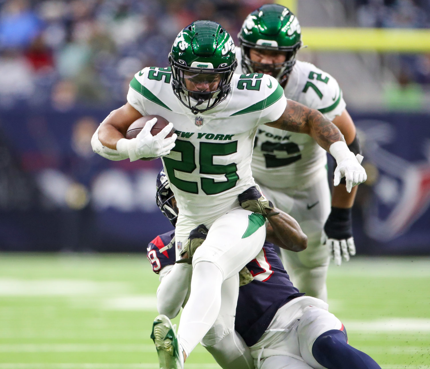 New York Jets running back Ty Johnson (25) carries the ball during an NFL game between the Houston Texans and the New York Jets on November 28, 2021 in Houston, Texas. The Jets won, 21-14