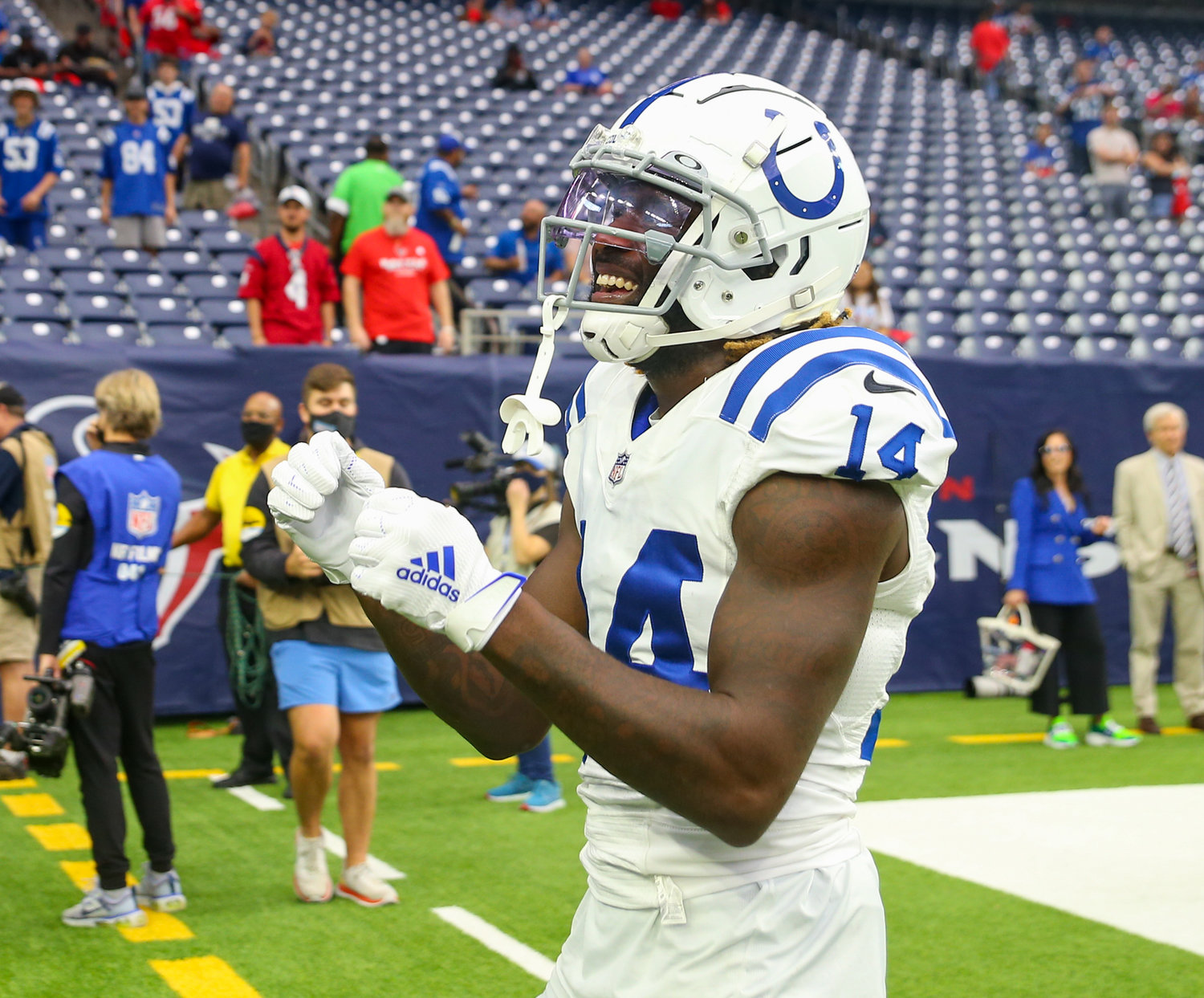 Indianapolis Colts wide receiver Zach Pascal (14) plays catch with fans before the start of an NFL game between the Texans and the Colts on December 5, 2021 in Houston, Texas.