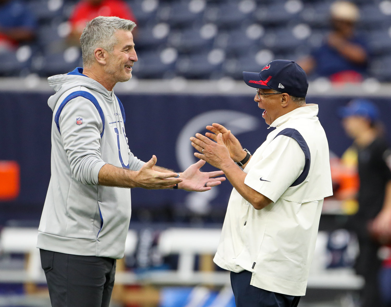Indianapolis Colts head coach Frank Reich (left) talks with Houston Texans head coach David Culley before the start of an NFL game between the Texans and the Colts on December 5, 2021 in Houston, Texas.