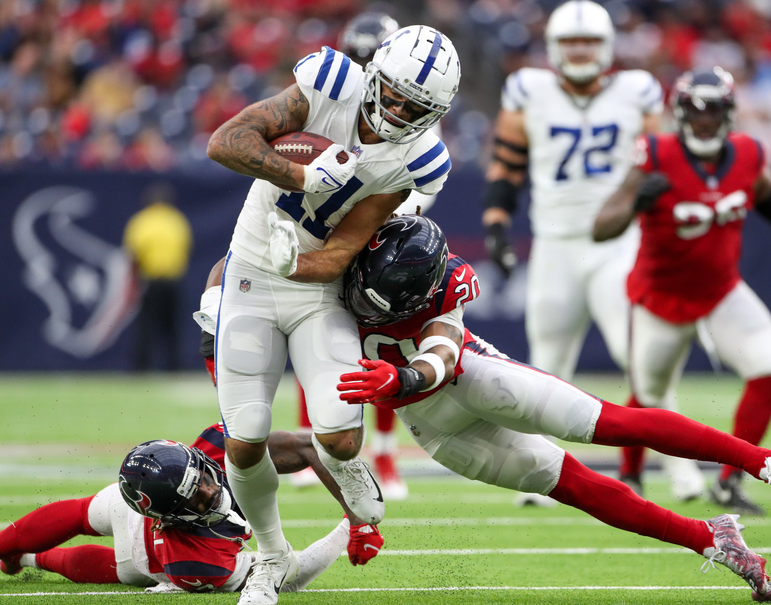 Houston Texans safety Justin Reid (20) tackles Indianapolis Colts wide receiver Michael Pittman Jr. (11) during an NFL game between the Texans and the Colts on December 5, 2021 in Houston, Texas.