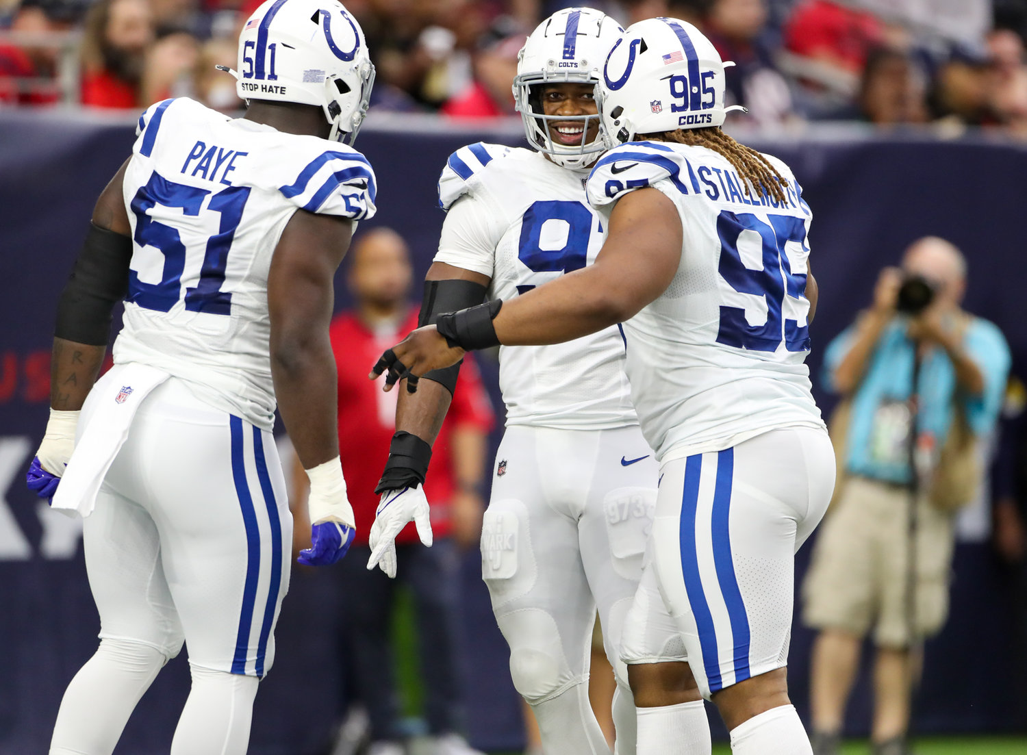 Indianapolis Colts defensive end Kwity Paye (51), defensive end Al-Quadin Muhammad (97) and defensive tackle Taylor Stallworth (95) celebrate after a sack during an NFL game between the Texans and the Colts on December 5, 2021 in Houston, Texas. The Colts won, 31-0.