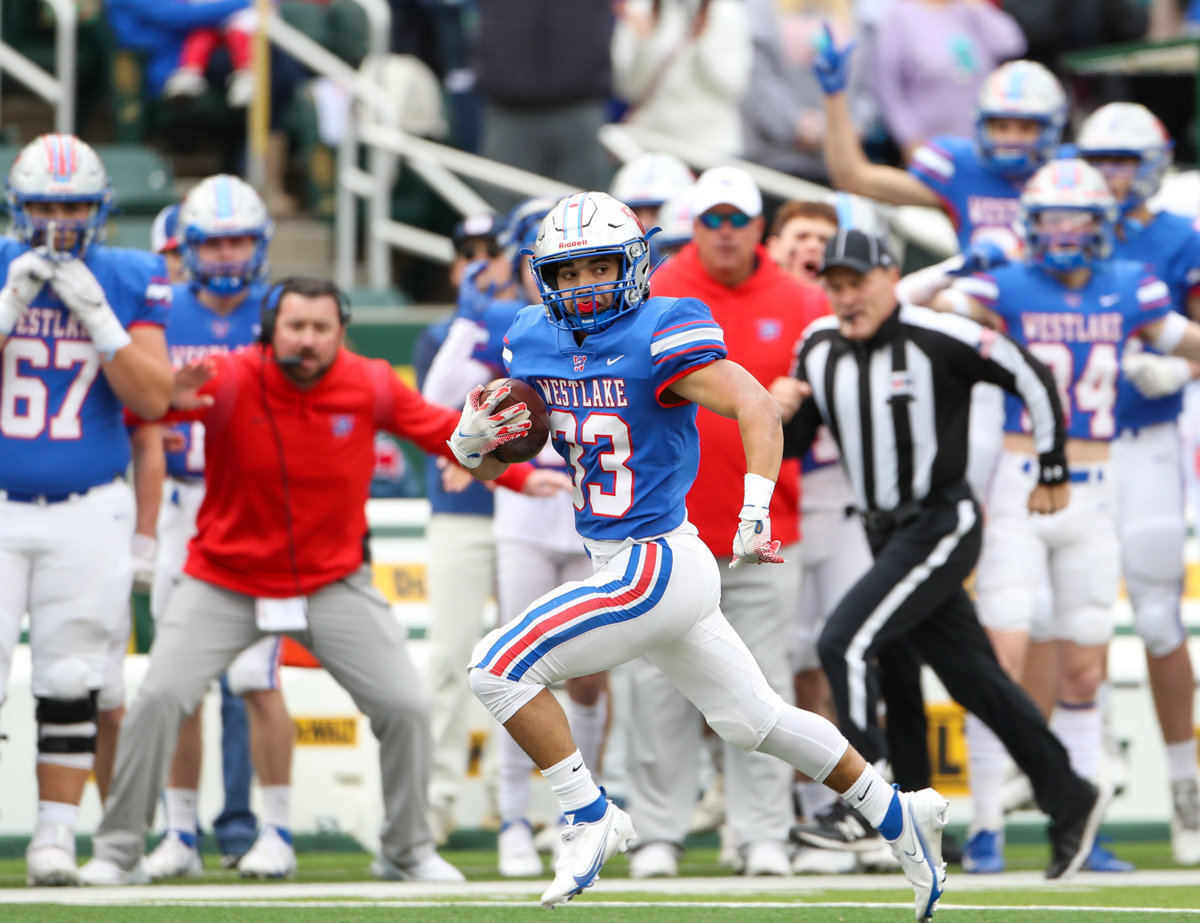 Westlake Chaparrals running back Jack Kayser (33) breaks free for a long touchdown run along the Westlake sideline during the Class 6A Division II state semifinal  game between Katy and Westlake on December 11, 2021 in Waco, Texas.
