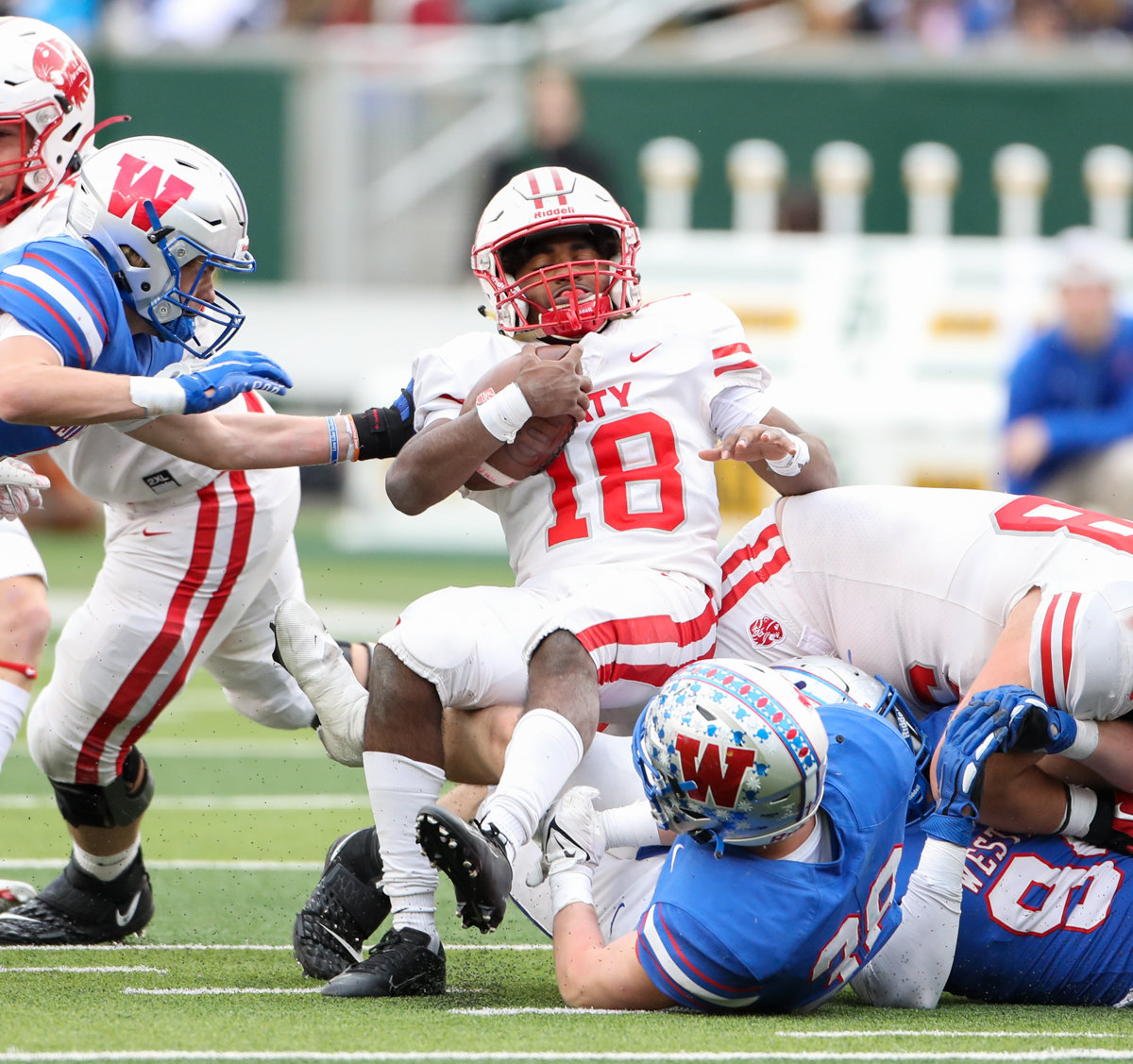 Katy Tigers running back Dallas Glass (18) is tackled during the Class 6A Division II state semifinal  game between Katy and Westlake on December 11, 2021 in Waco, Texas.
