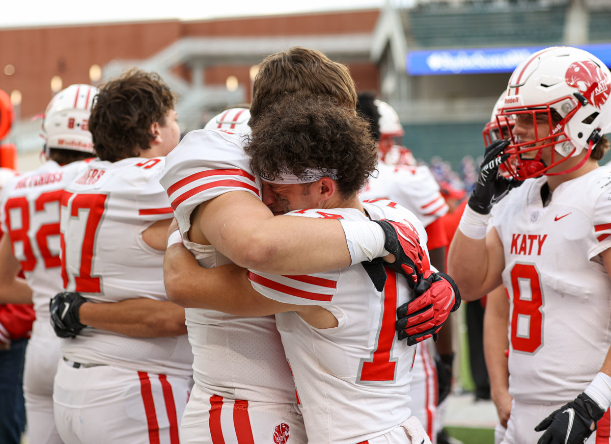 Katy Tigers players console each other after a 45-14 loss to Westlake in a Class 6A Division II state semifinal game on December 11, 2021 in Waco, Texas.