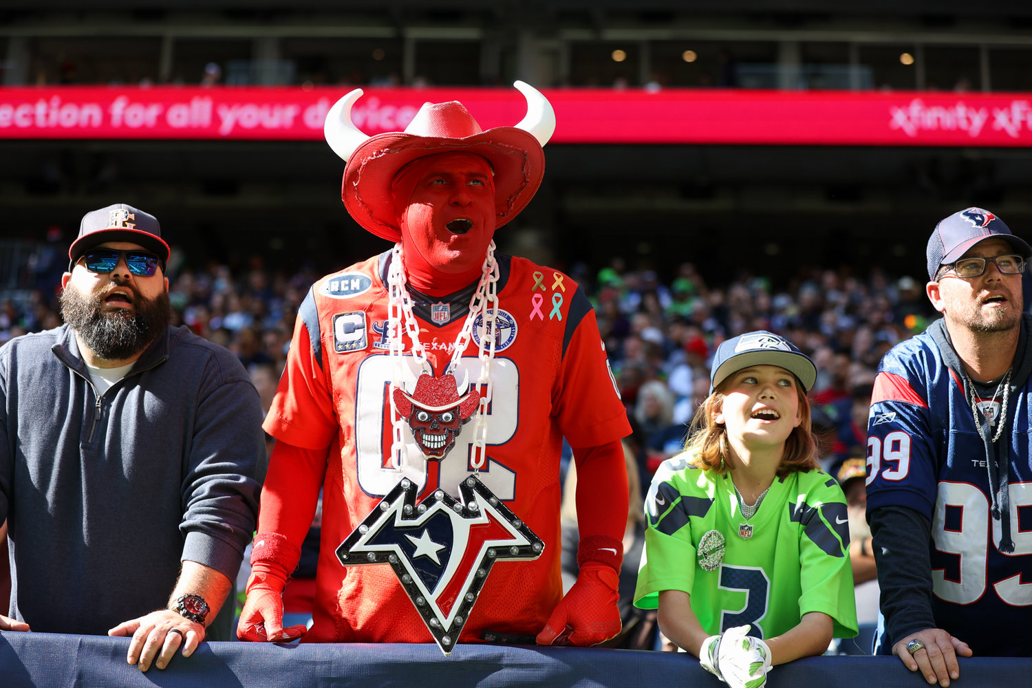Houston Texans and Seattle Seahawks fans cheer during the first half of an NFL game between the Seahawks and the Texans on December 12, 2021 in Houston, Texas.