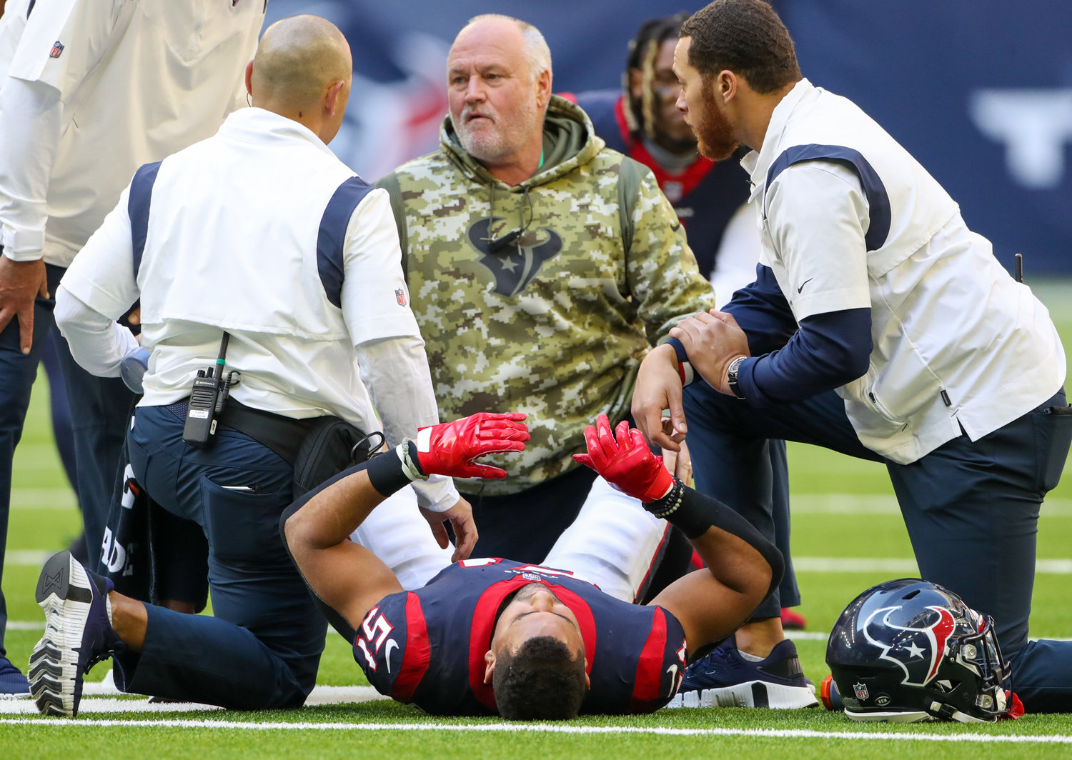 Trainers attend to Houston Texans linebacker Kamu Grugier-Hill (51) after an injury during the second half of an NFL game between the Seahawks and the Texans on December 12, 2021 in Houston, Texas.
