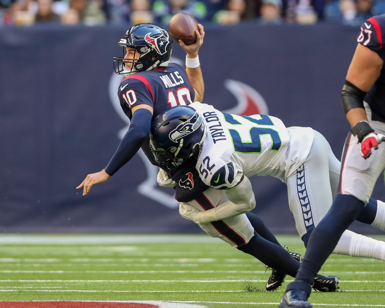Seattle Seahawks defensive end Darrell Taylor (52) sacks Houston Texans quarterback Davis Mills (10) during the second half of an NFL game between the Seahawks and the Texans on December 12, 2021 in Houston, Texas.