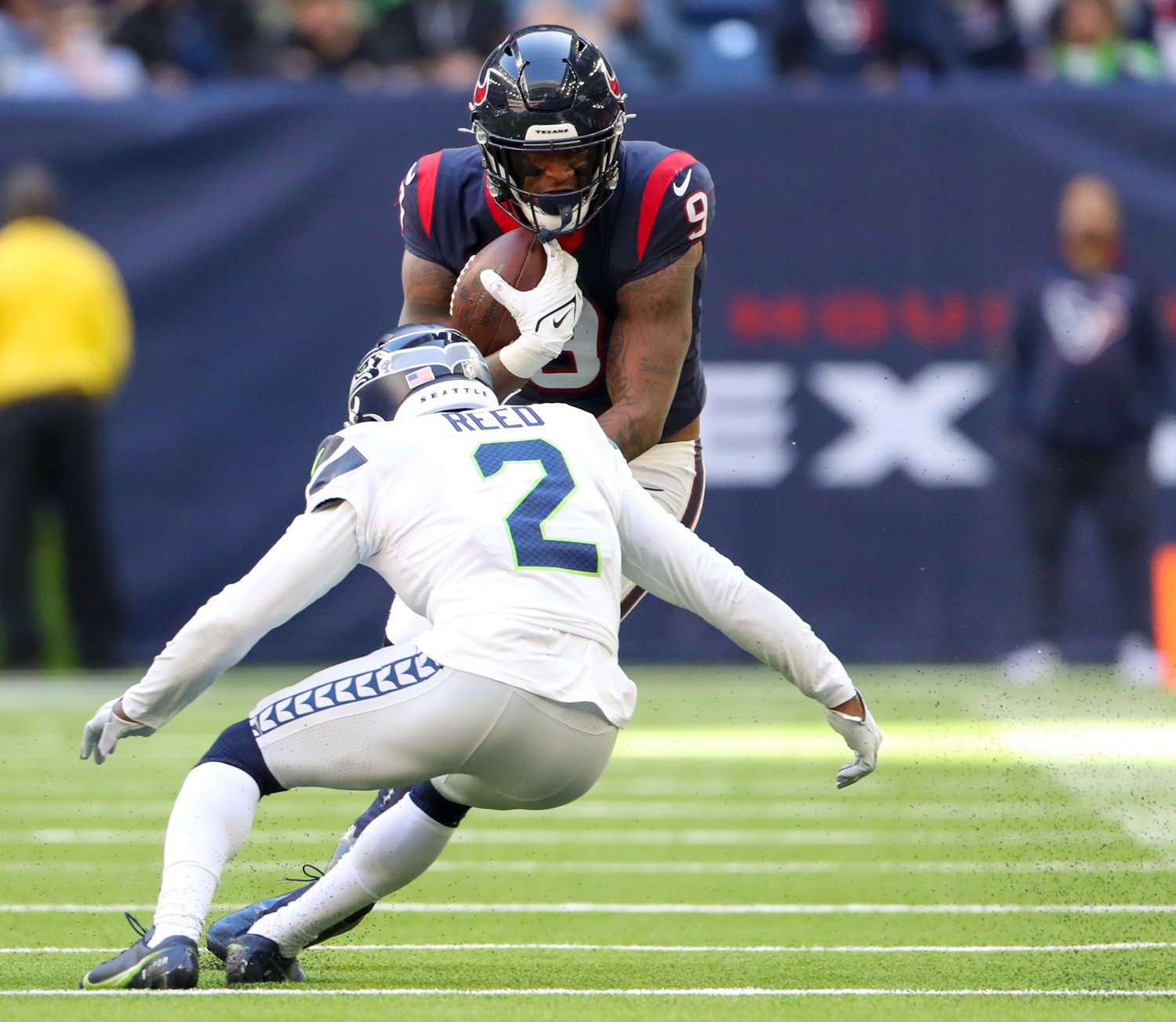 Houston Texans tight end Brevin Jordan (9) squares off against Seattle Seahawks cornerback D.J. Reed (2) after a catch during the second half of an NFL game between the Seahawks and the Texans on December 12, 2021 in Houston, Texas.