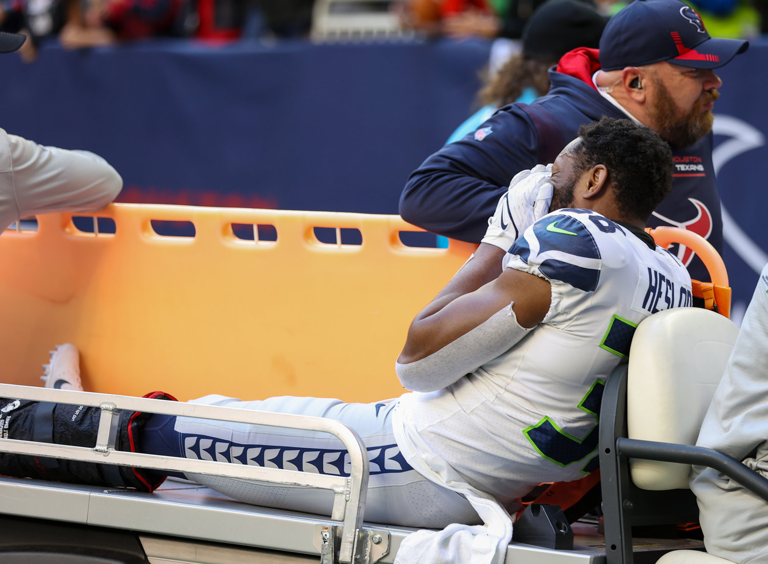 Seattle Seahawks cornerback Gavin Heslop (38) is carted off the field after sustaining a leg injury during the second half of an NFL game between the Seahawks and the Texans on December 12, 2021 in Houston, Texas.