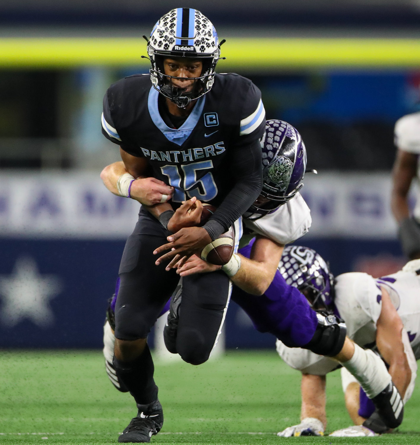 Paetow Panthers quarterback C.J. Dumas Jr. (15) nearly loses control of the ball on a carry during the Class 5A Division I state football championship game between Paetow and College Station on December 17, 2021 in Arlington, Texas.