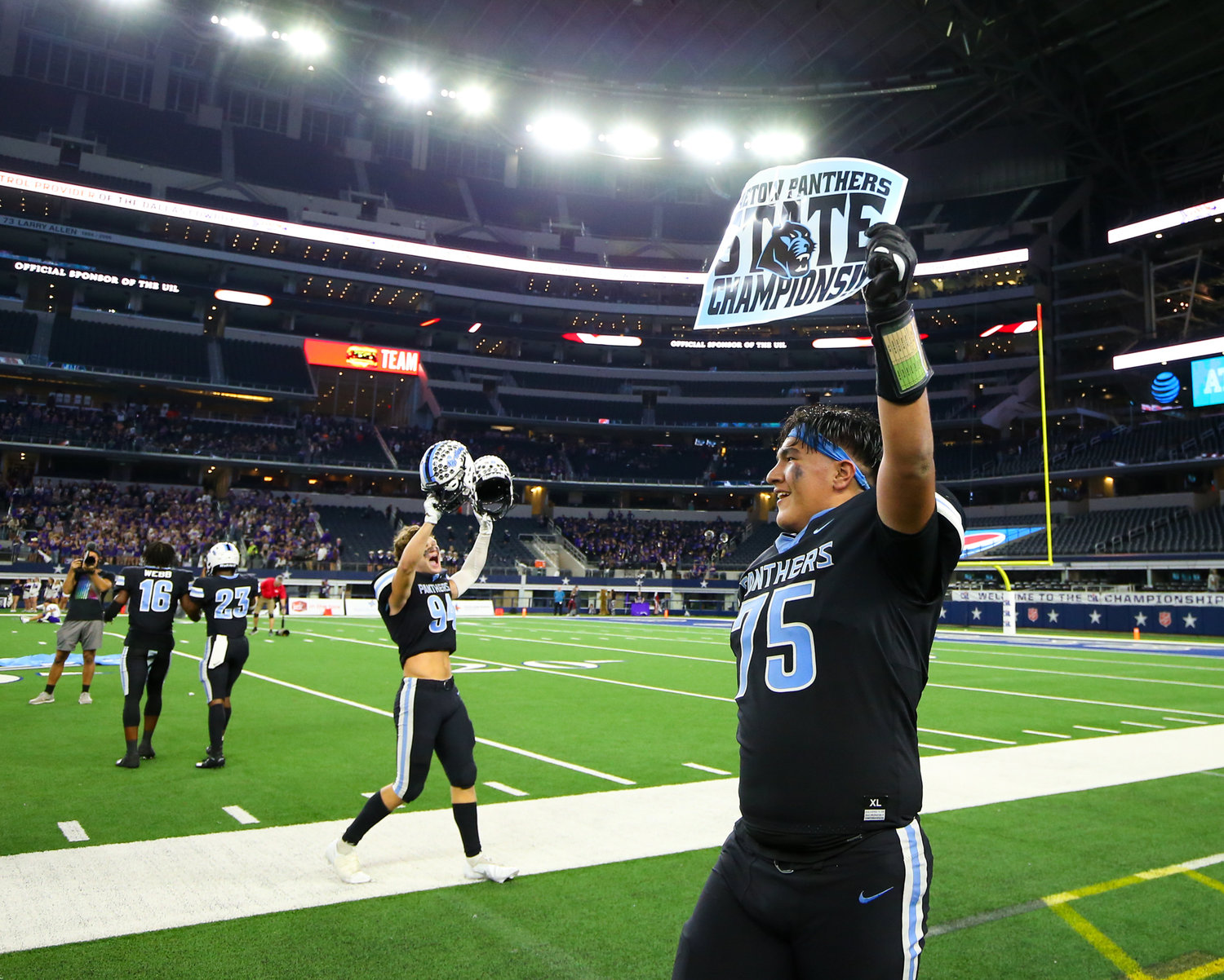 Paetow Panthers players celebrate a 27-24 win over College Station in the Class 5A Division I state football championship game on December 17, 2021 in Arlington, Texas.