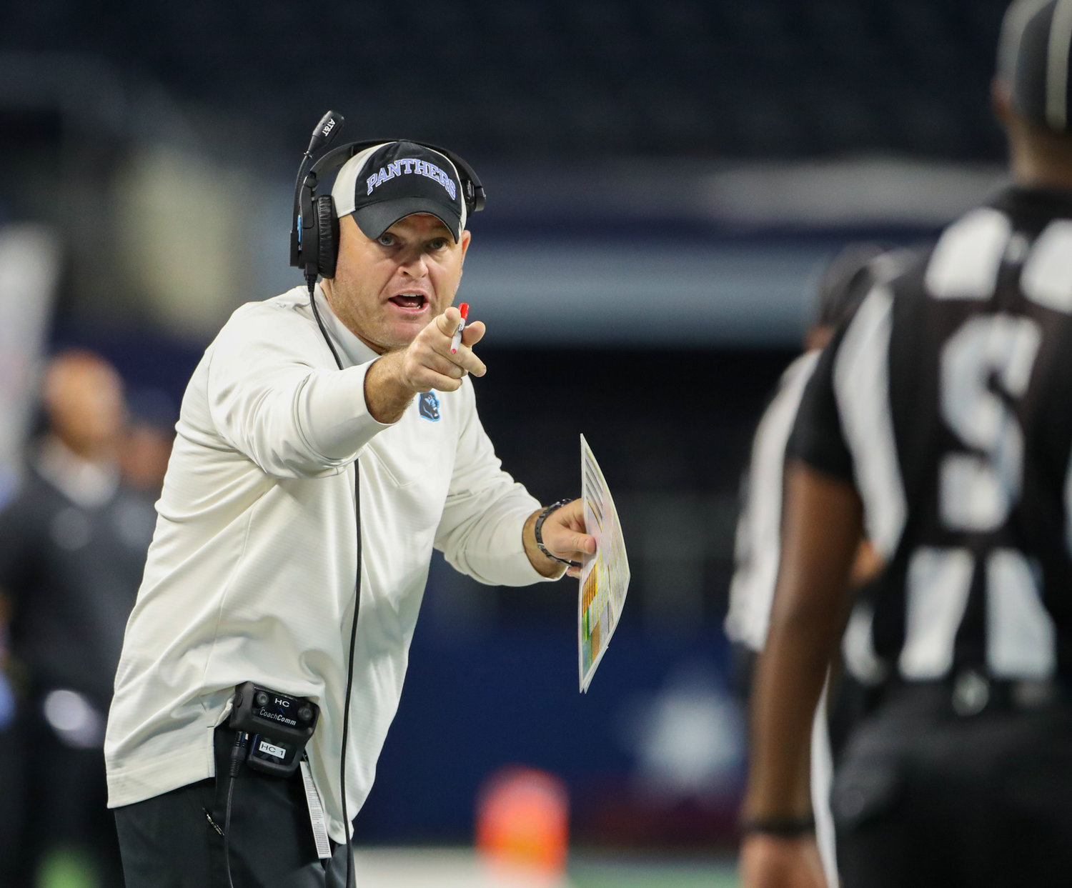 Paetow Panthers head coach B.J. Gotte talks to a game official during the Class 5A-Division I state football championship game between Paetow and College Station on December 17, 2021 in Arlington, Texas.