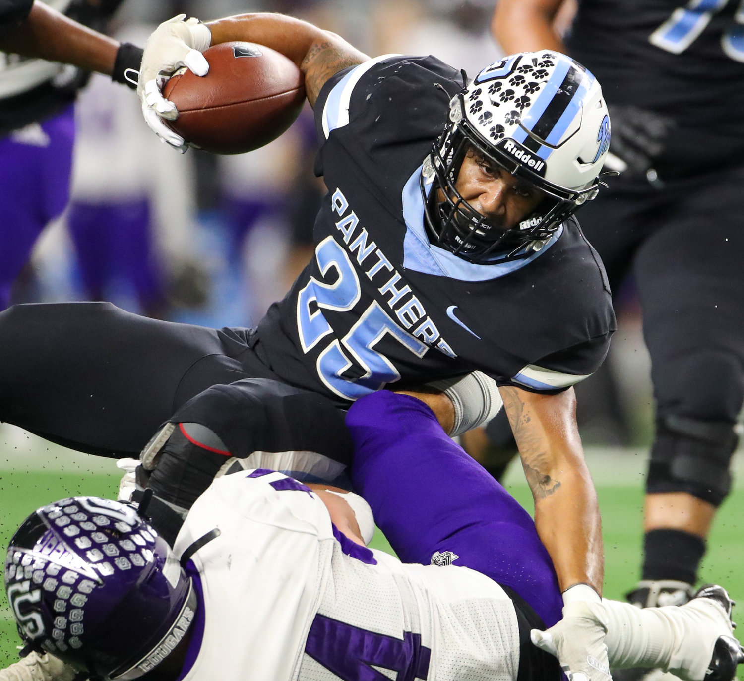 Paetow Panthers running back Jacob Brown (25) is tackled on a carry during the Class 5A Division I state football championship game between Paetow and College Station on December 17, 2021 in Arlington, Texas.